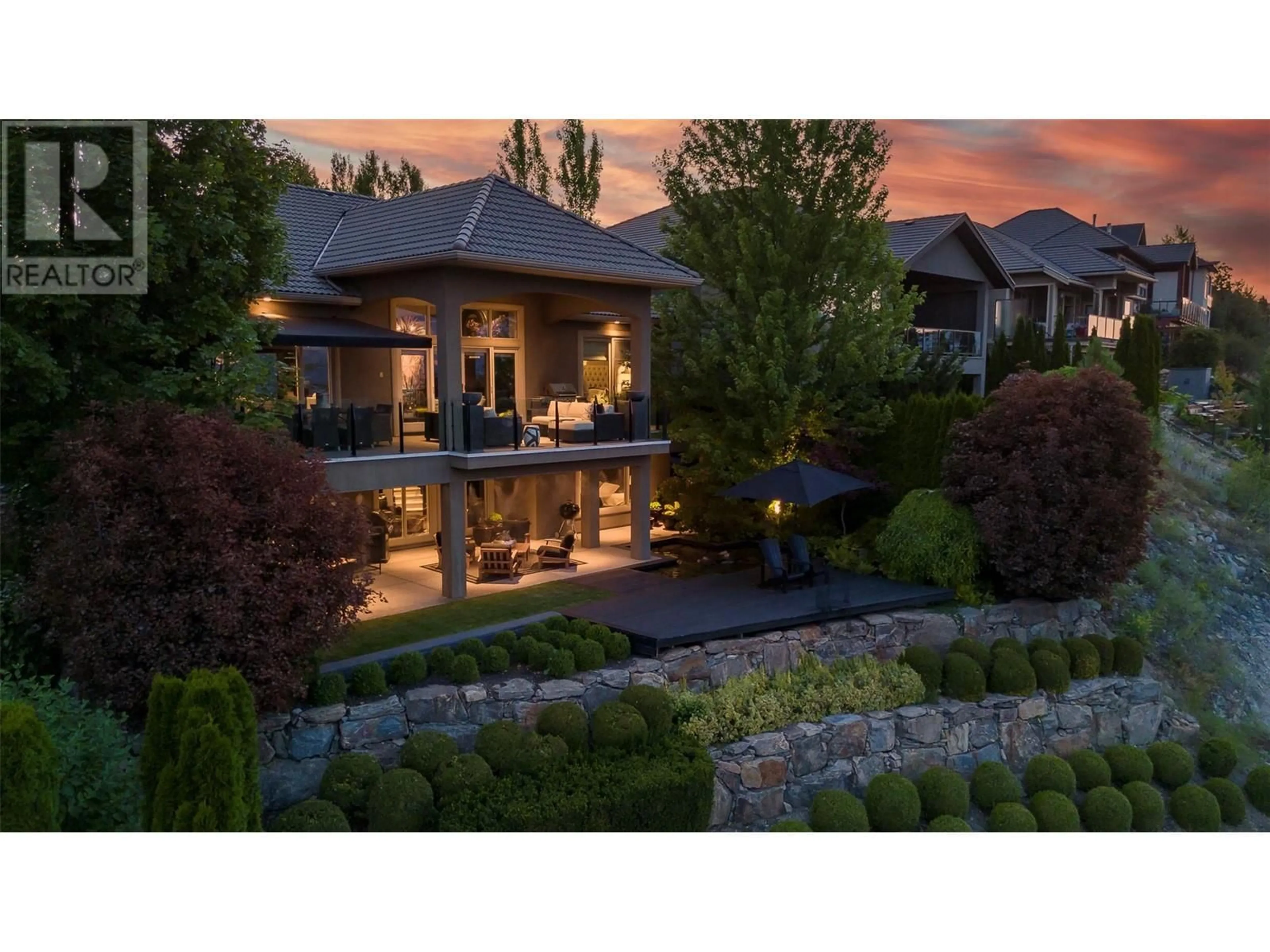 Frontside or backside of a home, the fenced backyard for 1749 Capistrano Drive, Kelowna British Columbia V1V2Z3