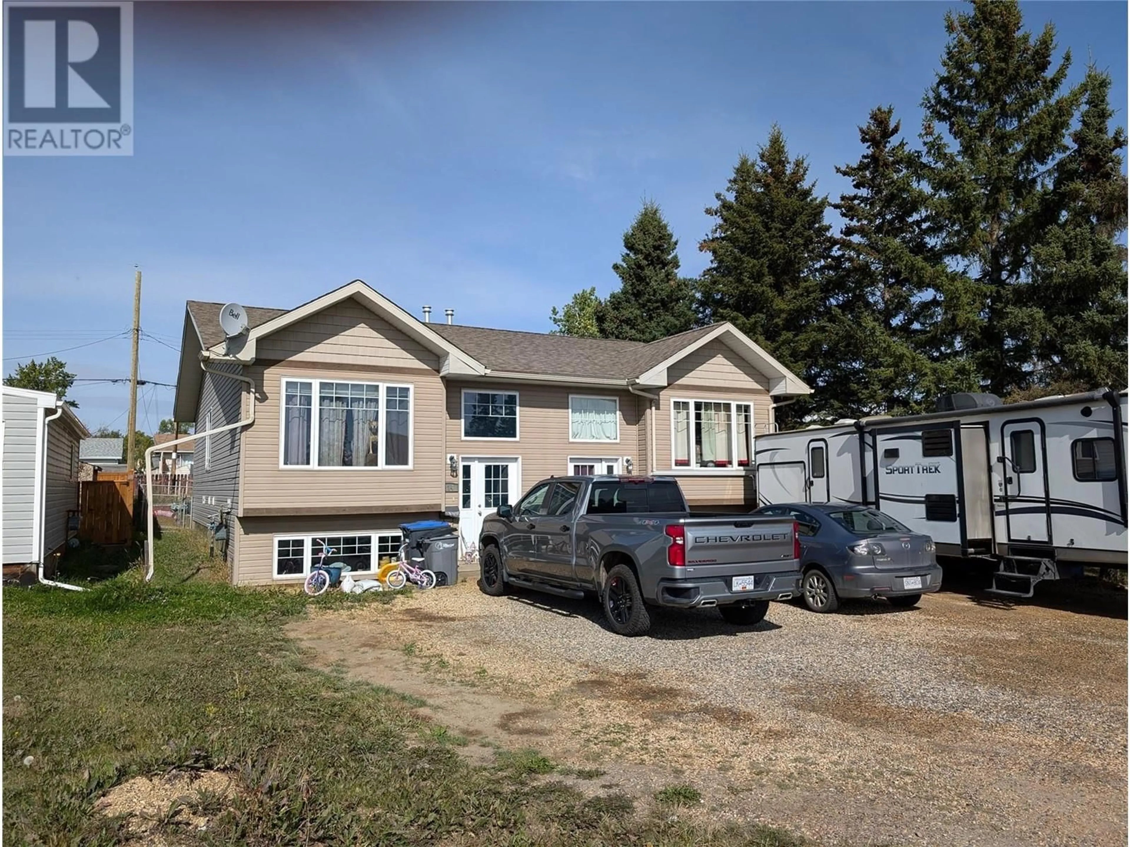 Frontside or backside of a home, cottage for 312 99 Avenue, Dawson Creek British Columbia V1G1S9