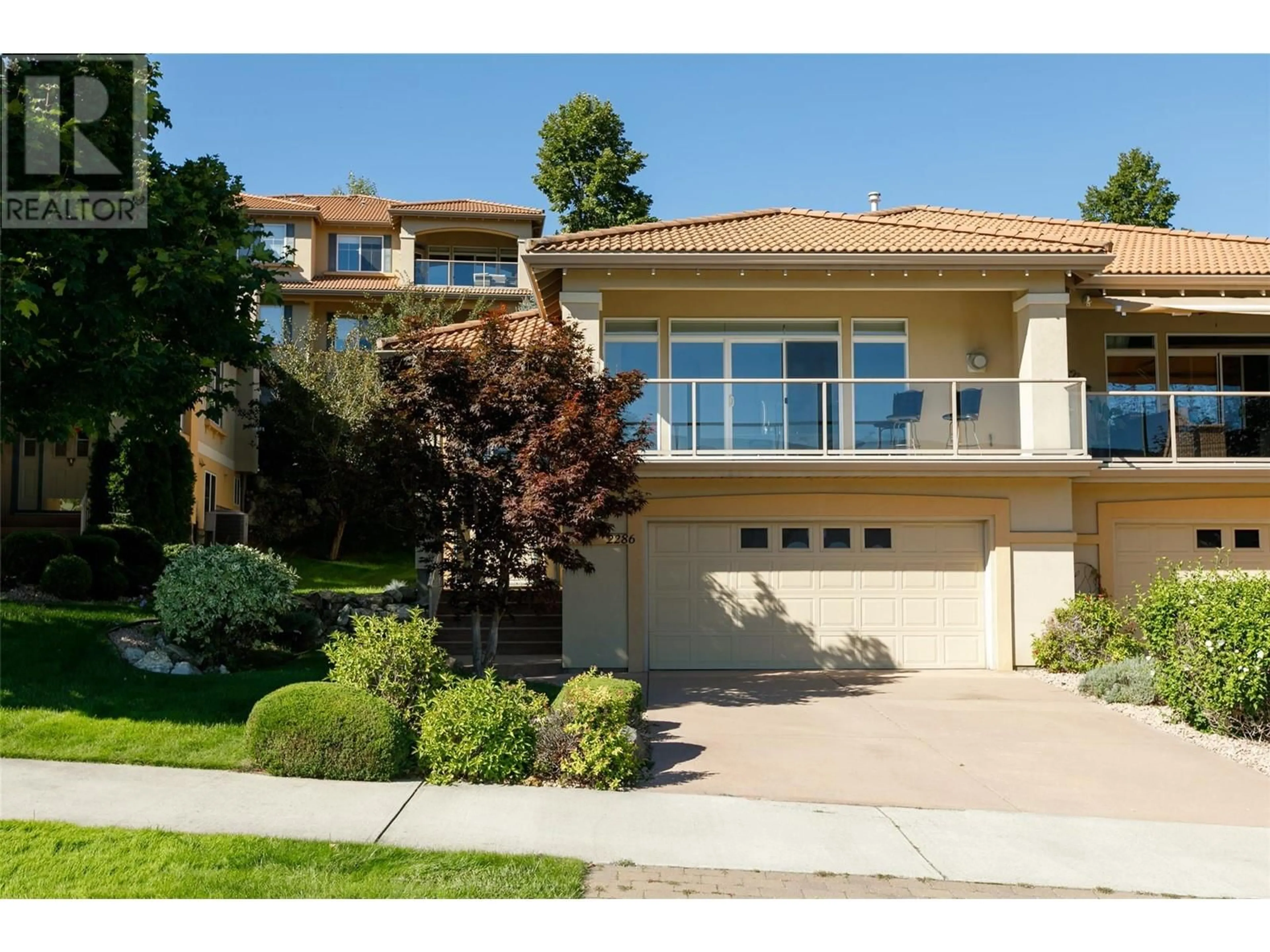 Frontside or backside of a home, the street view for 2286 Country Club Drive, Kelowna British Columbia V1V2M6