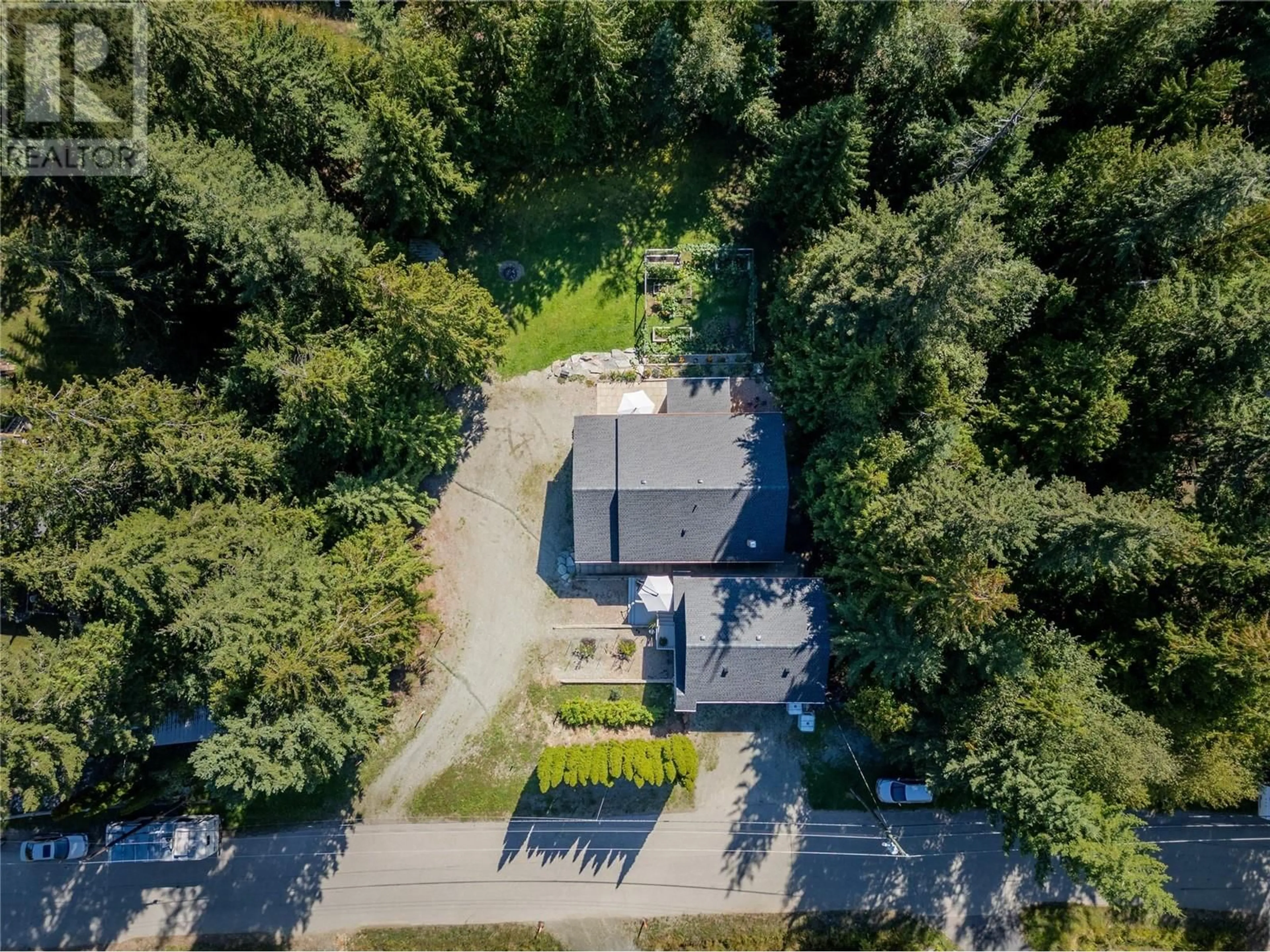 A pic from outside/outdoor area/front of a property/back of a property/a pic from drone, street for 7438 Anglemont Drive, Anglemont British Columbia V0E1M8