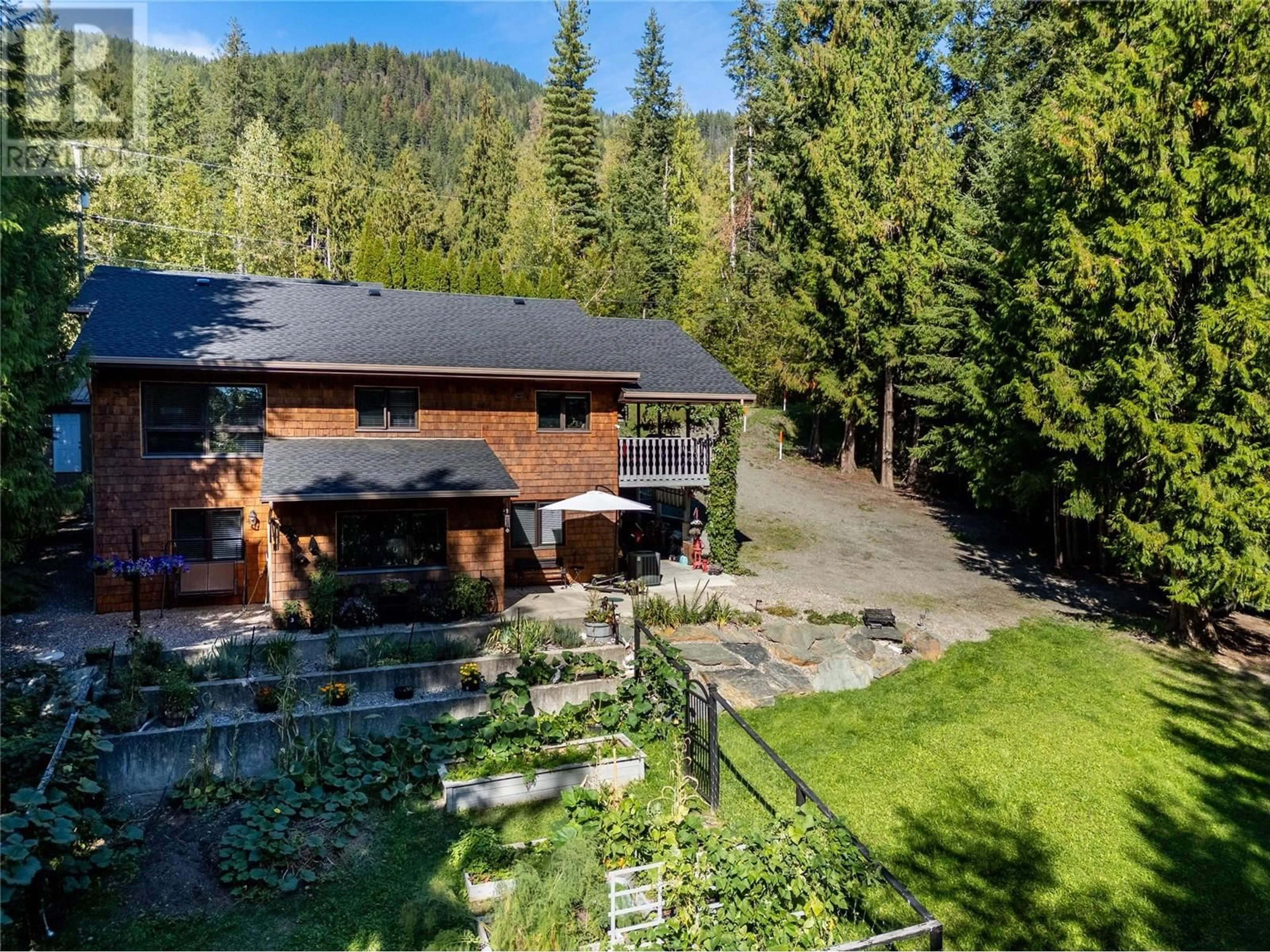 A pic from outside/outdoor area/front of a property/back of a property/a pic from drone, unknown for 7438 Anglemont Drive, Anglemont British Columbia V0E1M8