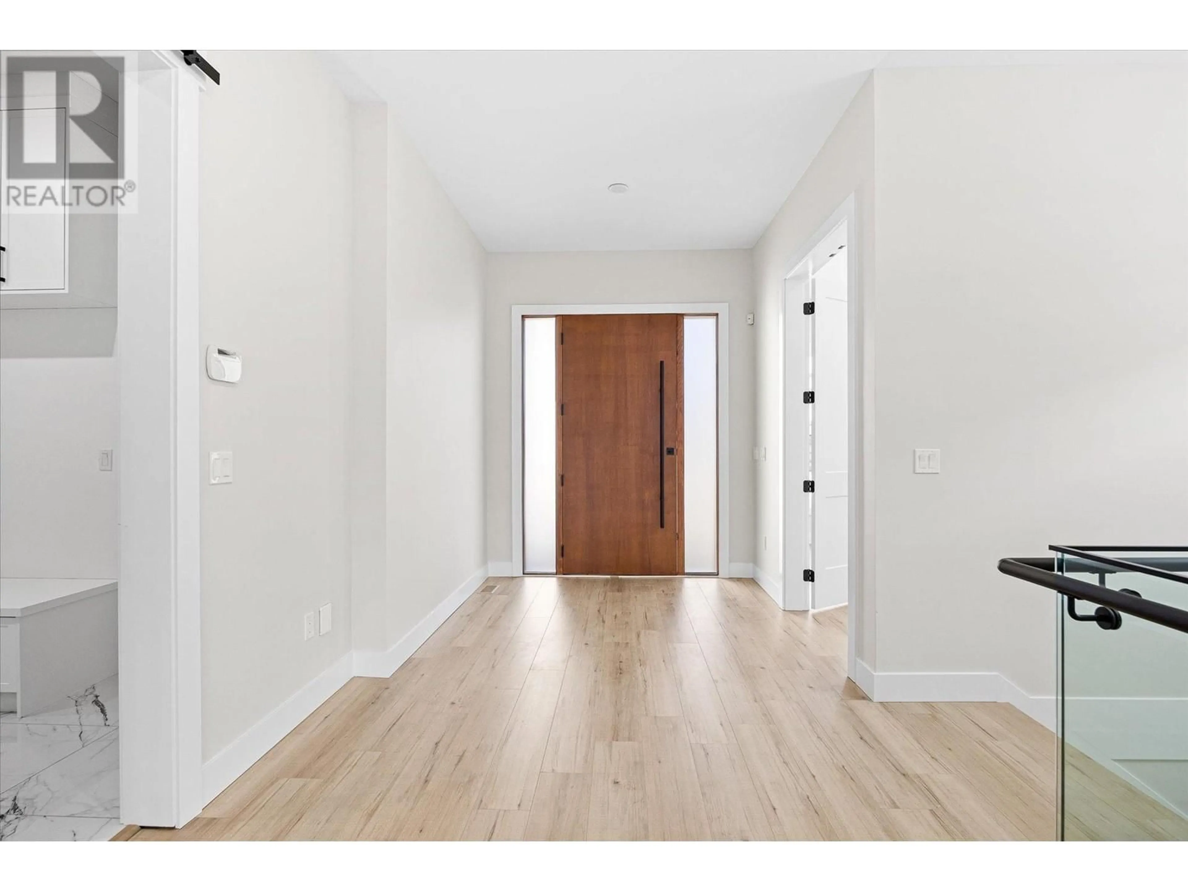 Indoor entryway, wood floors for 528 Hawes Court, Kelowna British Columbia V1W5C5