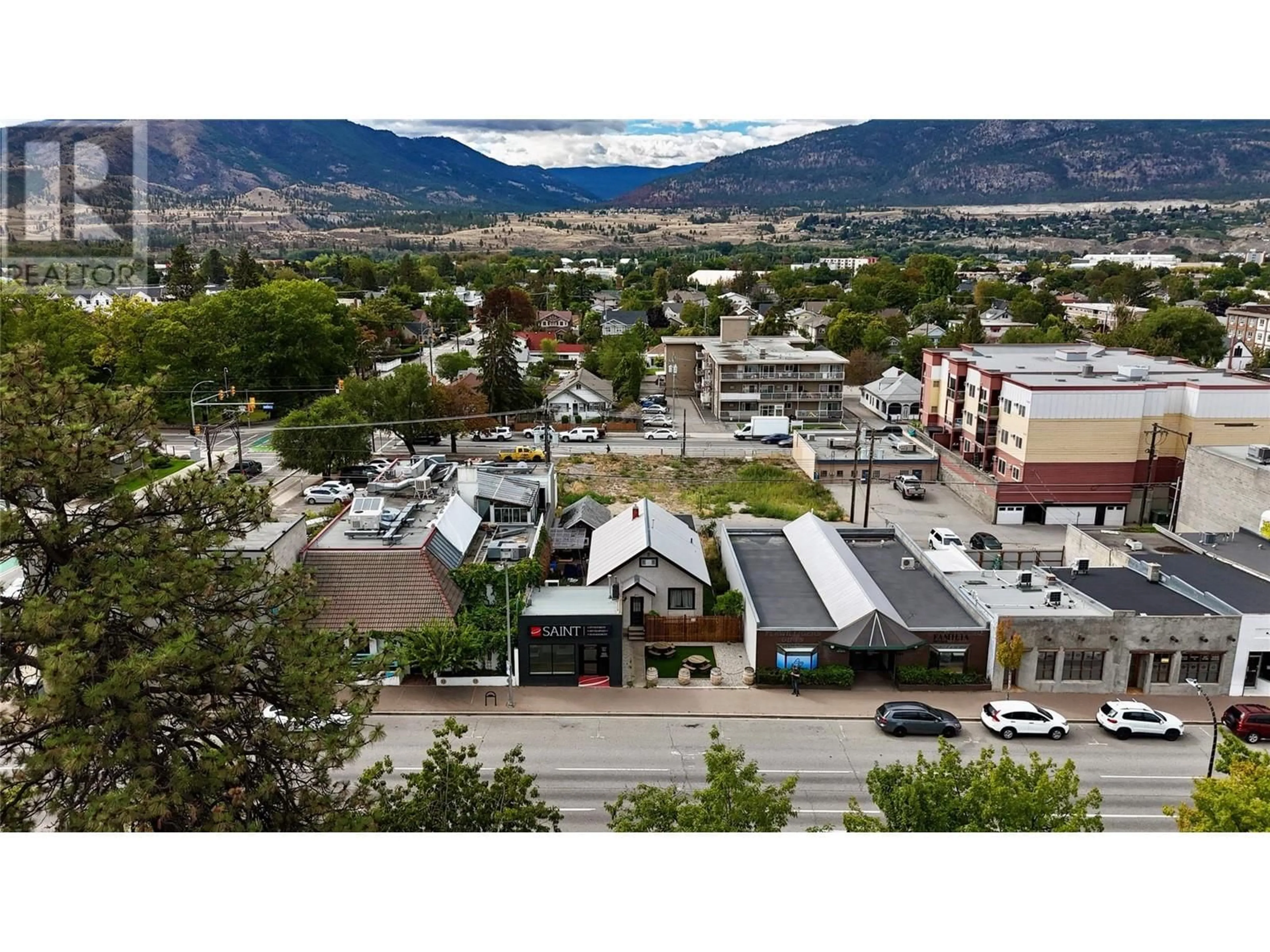 A pic from outside/outdoor area/front of a property/back of a property/a pic from drone, mountain view for 681 Main Street, Penticton British Columbia V2A5C9