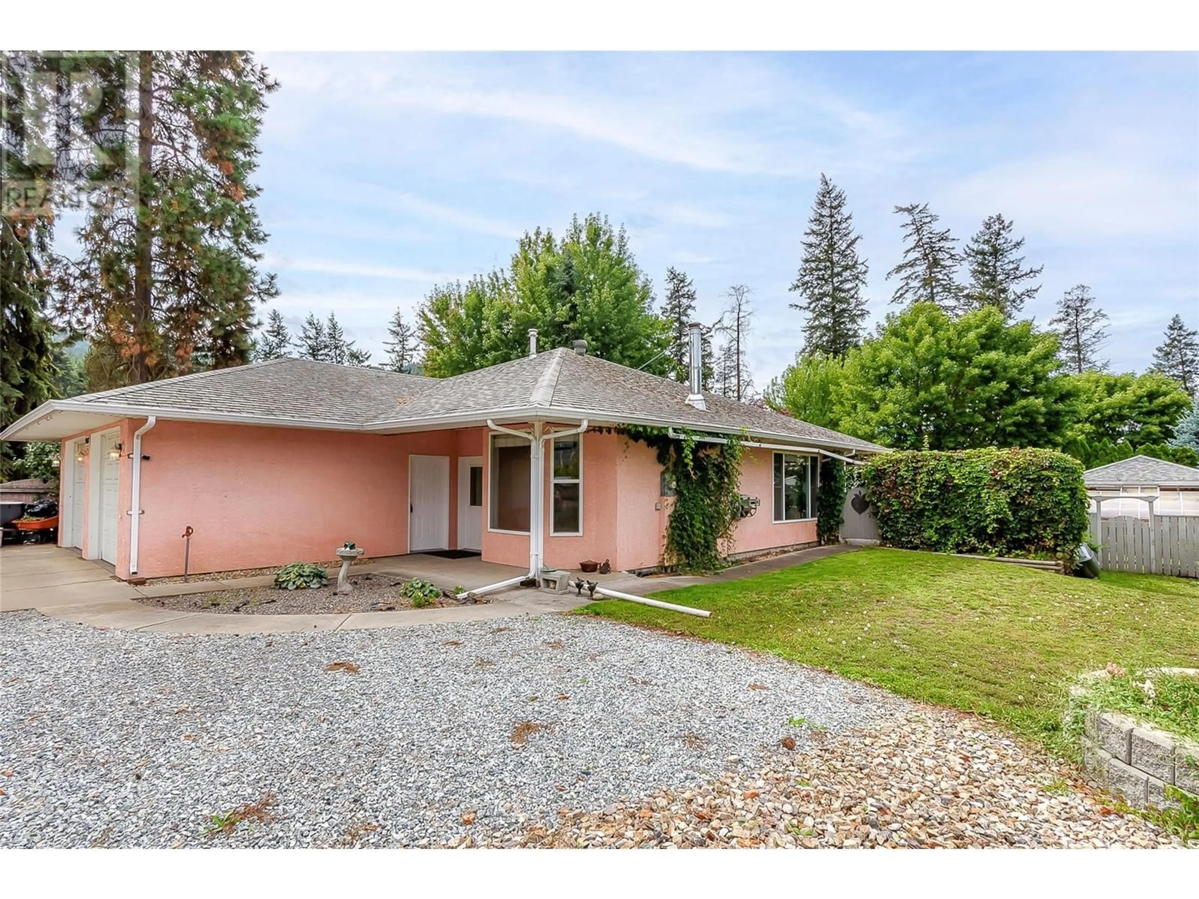 A pic from outside/outdoor area/front of a property/back of a property/a pic from drone, street for 9418 DAWE DRIVE, Coldstream British Columbia V1B3V7