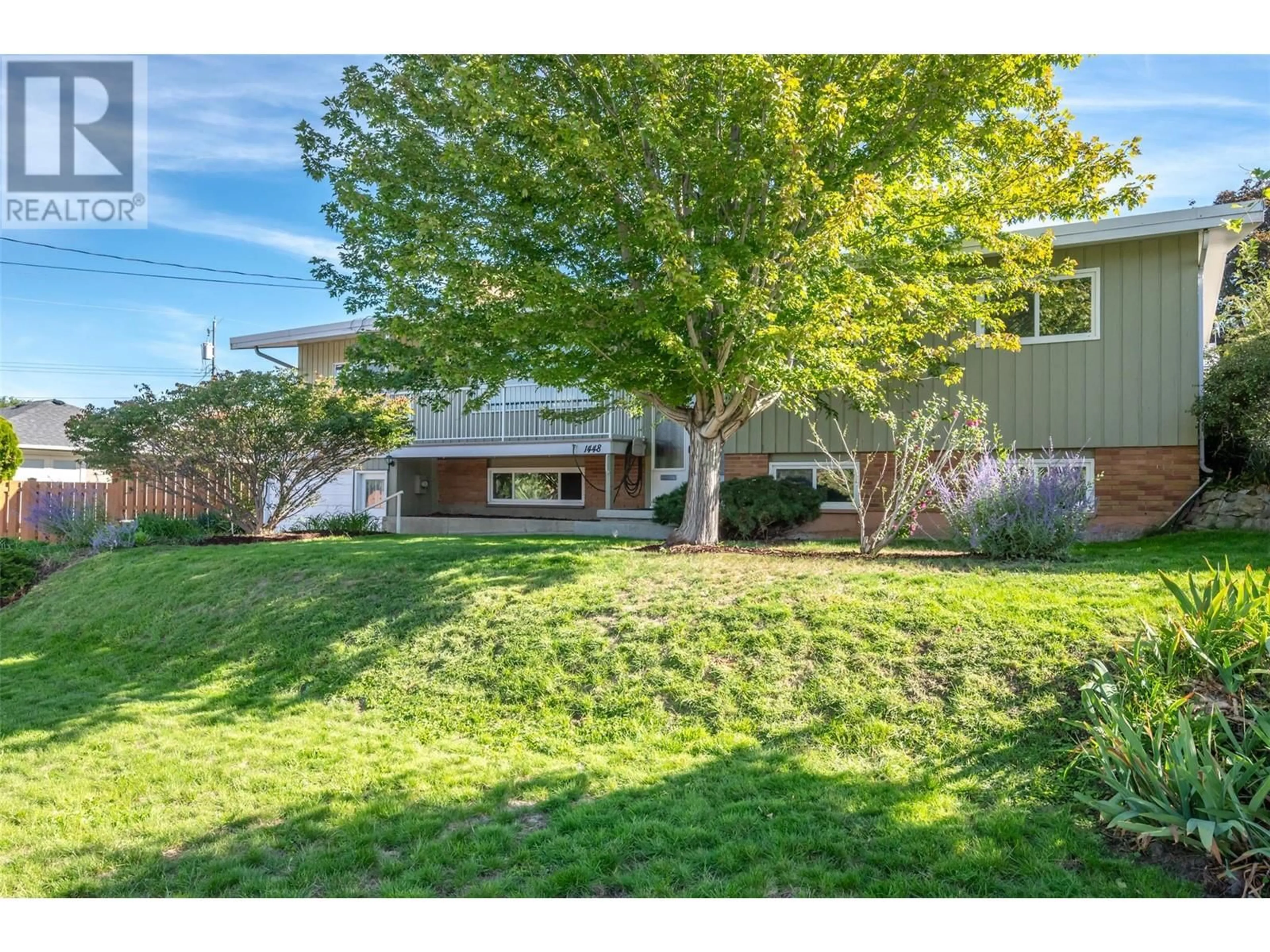 Frontside or backside of a home, the fenced backyard for 1448 Darmouth Street, Penticton British Columbia V2A4B6