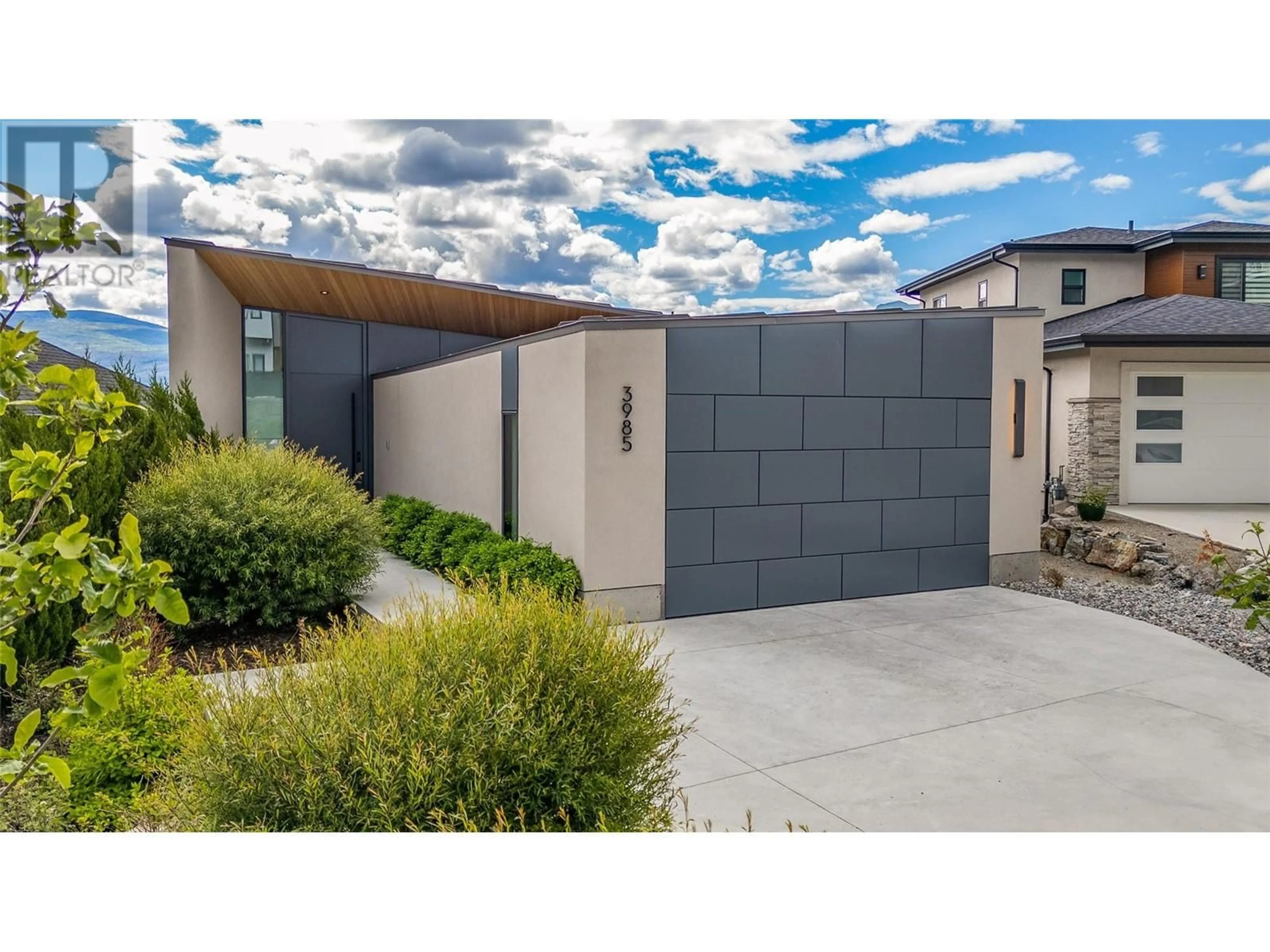 Frontside or backside of a home, the fenced backyard for 3985 Beachview Drive, West Kelowna British Columbia V4T2K1