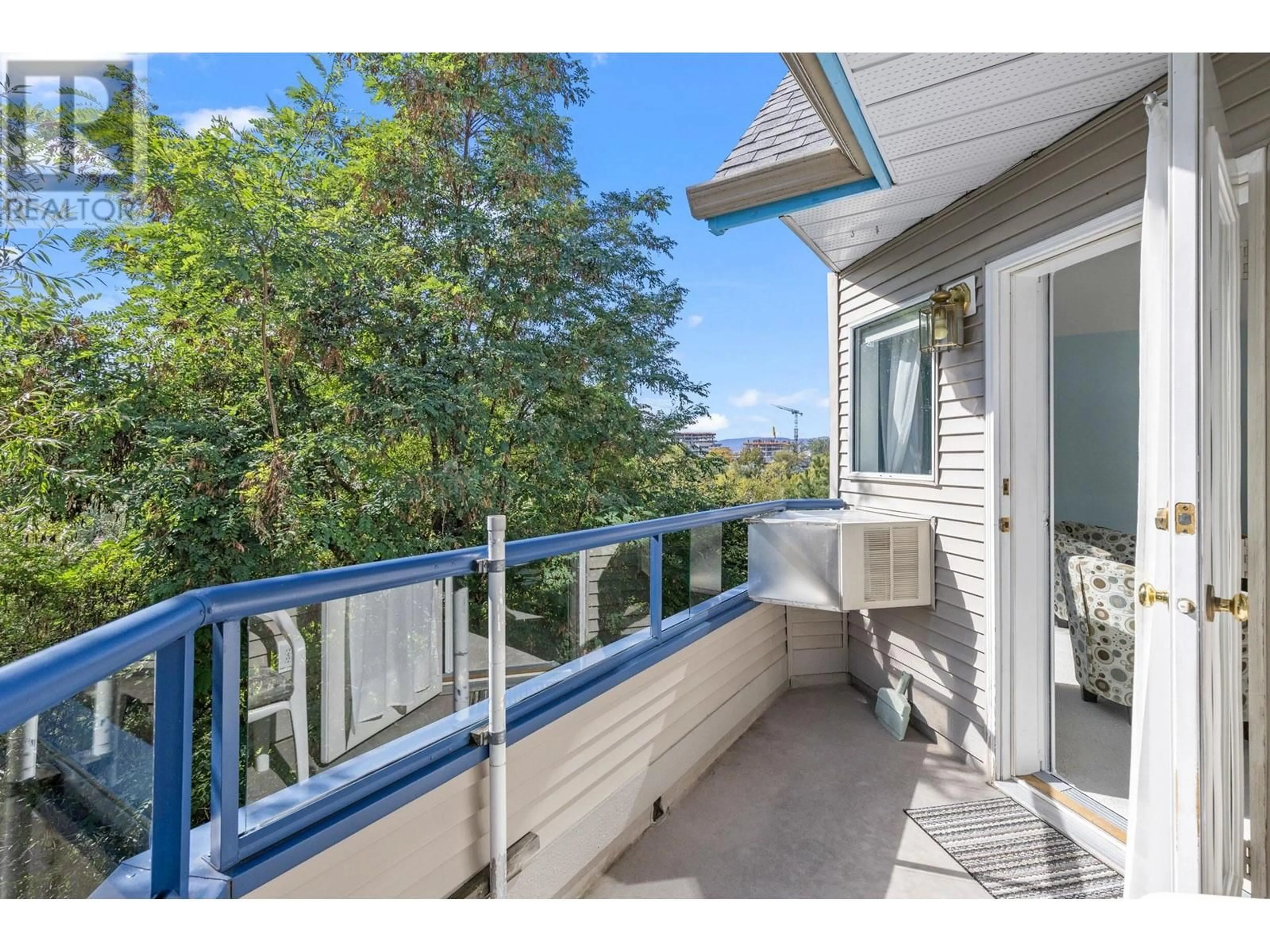 Balcony in the apartment, the fenced backyard for 3283 Casorso Road Unit# 303, Kelowna British Columbia V1W3L6