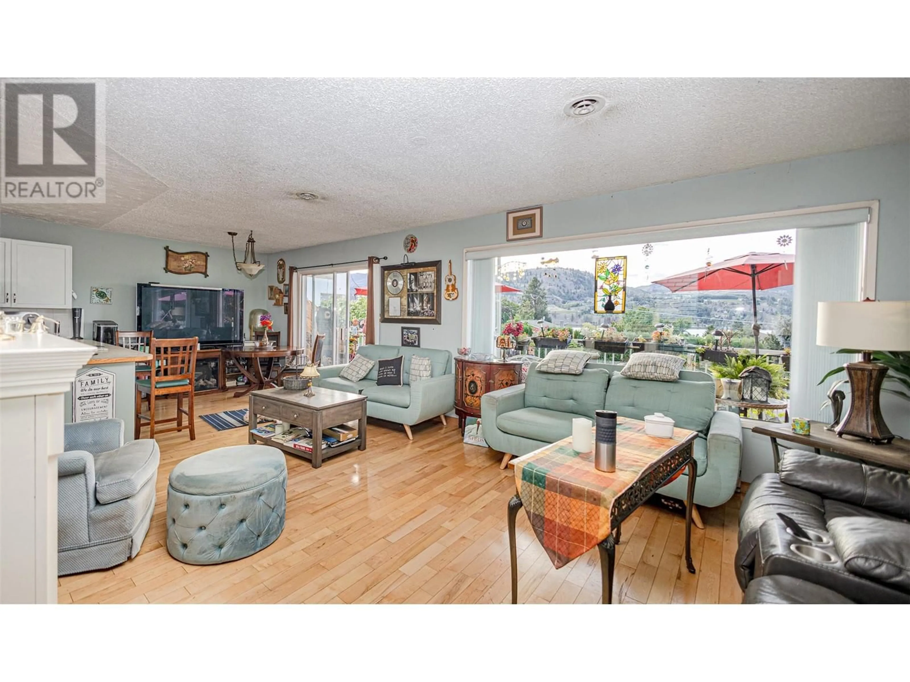 Living room, wood floors for 317 Carmel Crescent, Okanagan Falls British Columbia V0H1R5