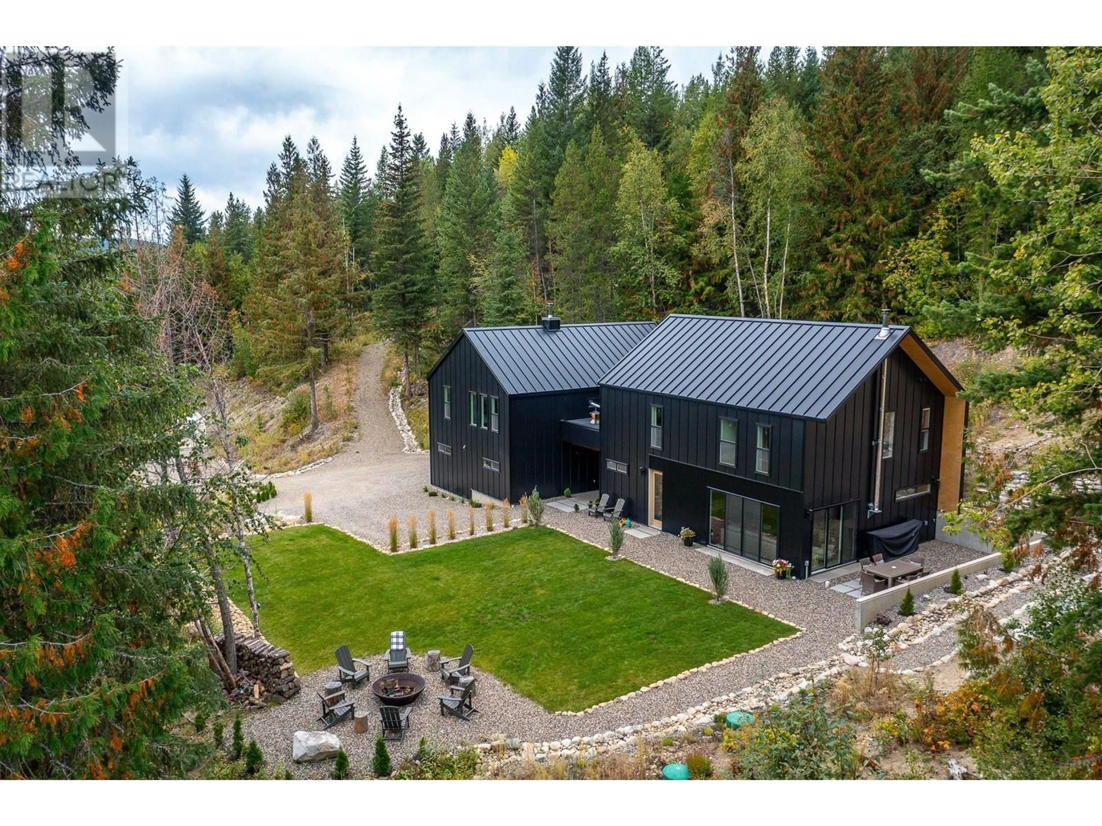 A pic from outside/outdoor area/front of a property/back of a property/a pic from drone, forest/trees view for 8725 FORSBERG ROAD, Vernon British Columbia V1B3M6