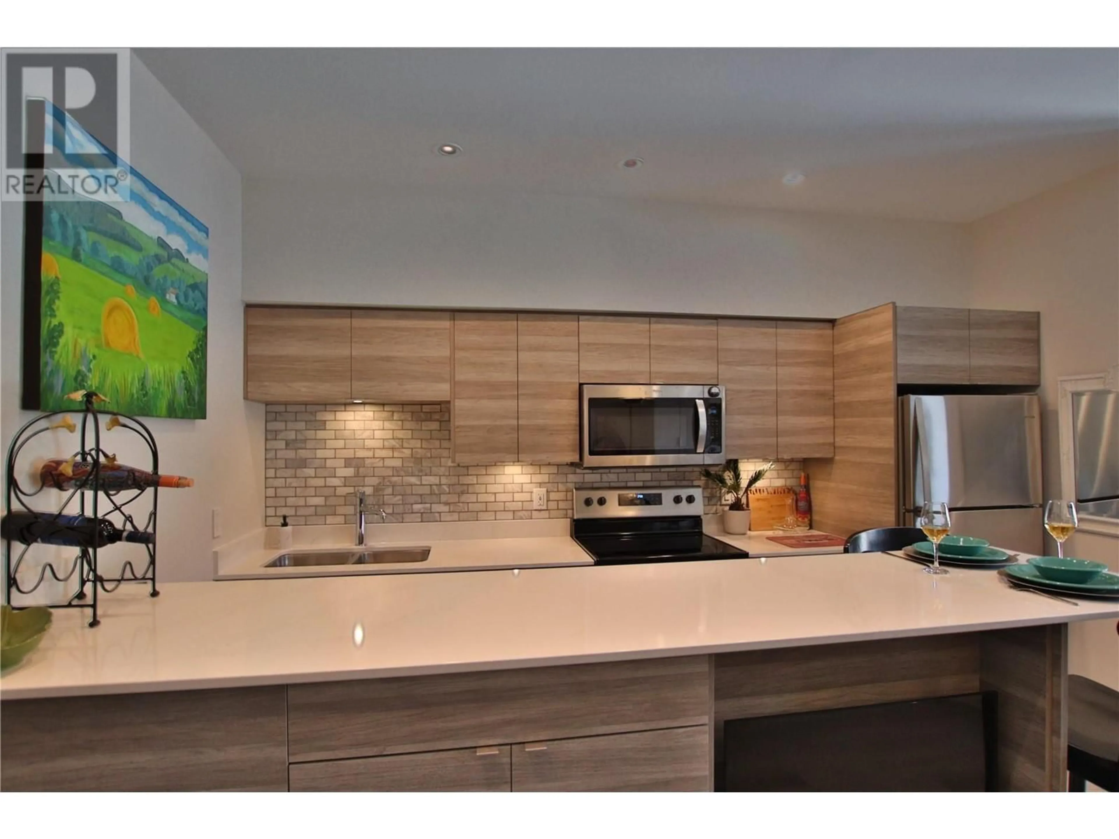 Contemporary kitchen, wood floors for 2555 Lakeshore Road Unit# 414, Vernon British Columbia V1H1M9