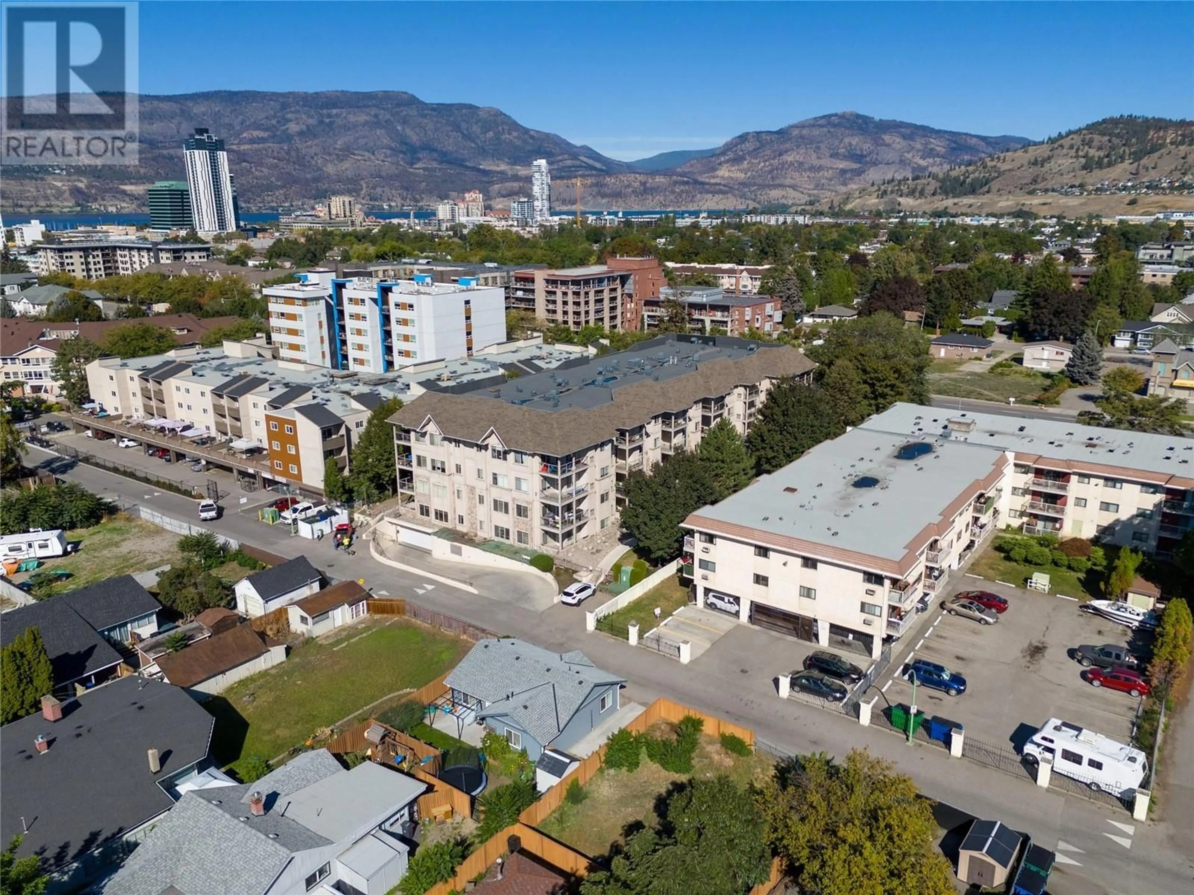 A pic from exterior of the house or condo, the view of city buildings for 1007 Harvey Avenue Unit# 204, Kelowna British Columbia V1Y6E4