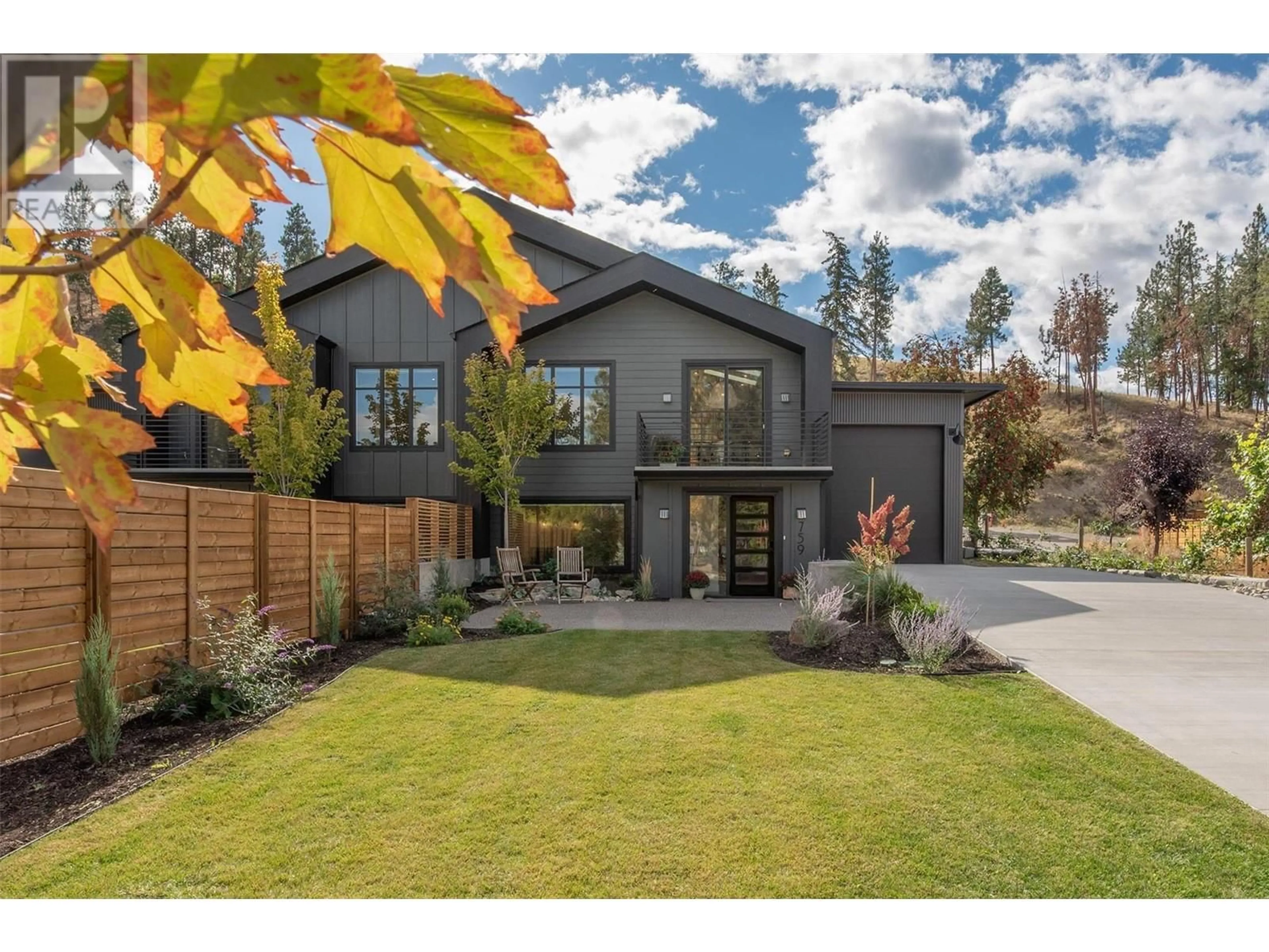 Frontside or backside of a home, the fenced backyard for 759 Barnaby Road, Kelowna British Columbia V1W4N9