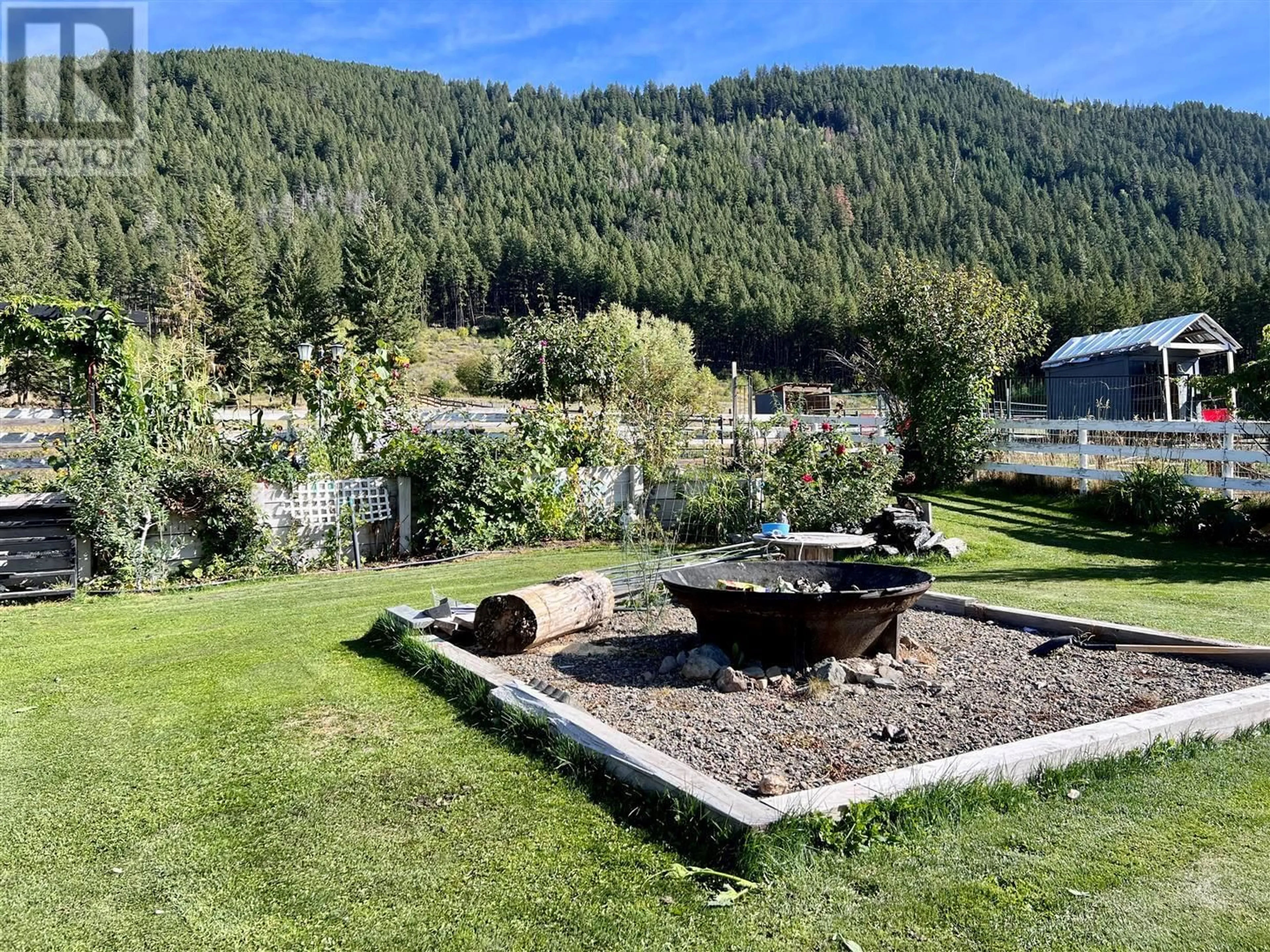 Patio, the fenced backyard for 5140 Warren Creek Road, Falkland British Columbia V0E1W0