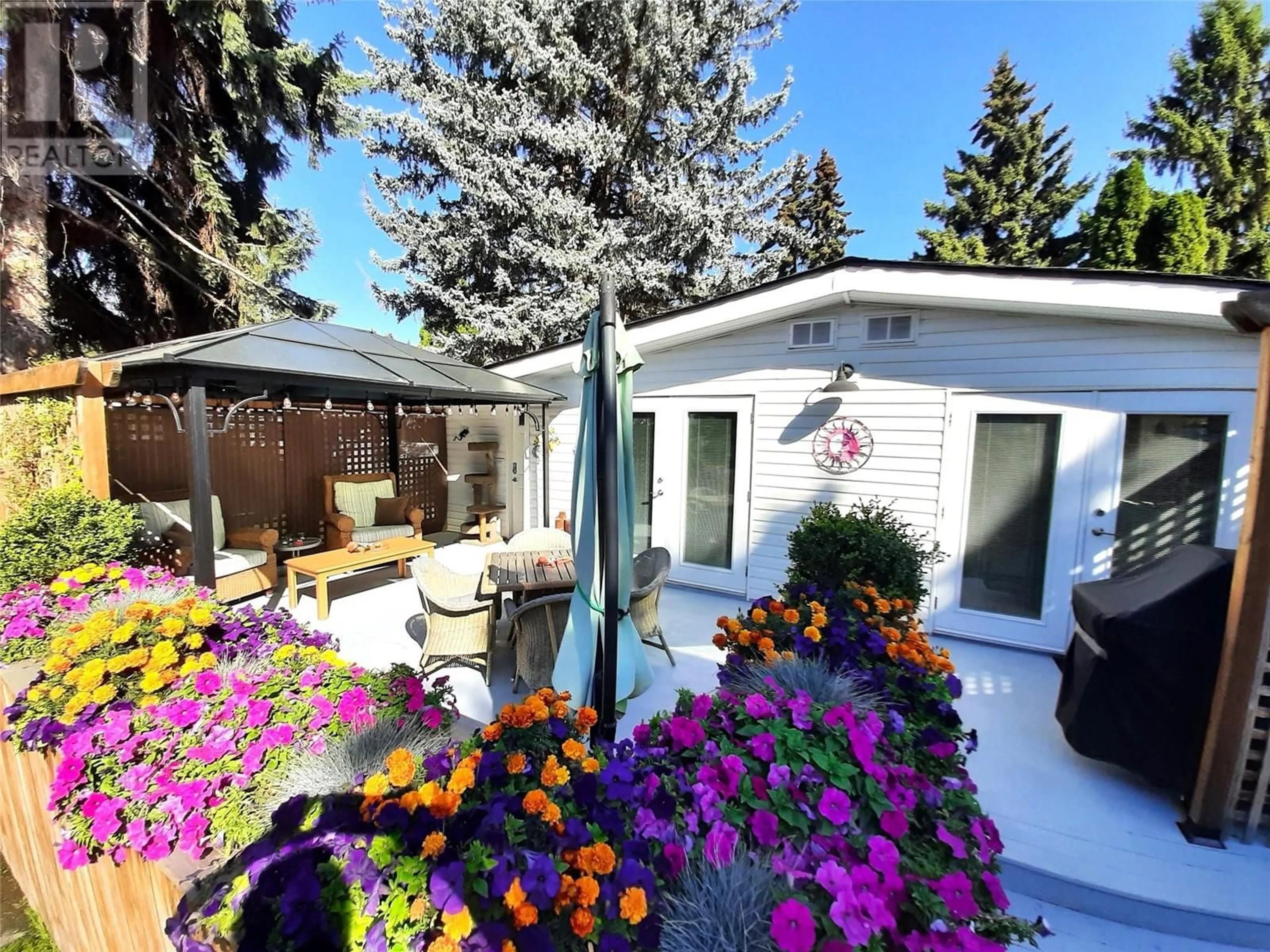 Patio, the fenced backyard for 3535 Casorso Unit# 57, Kelowna British Columbia V1W3E1