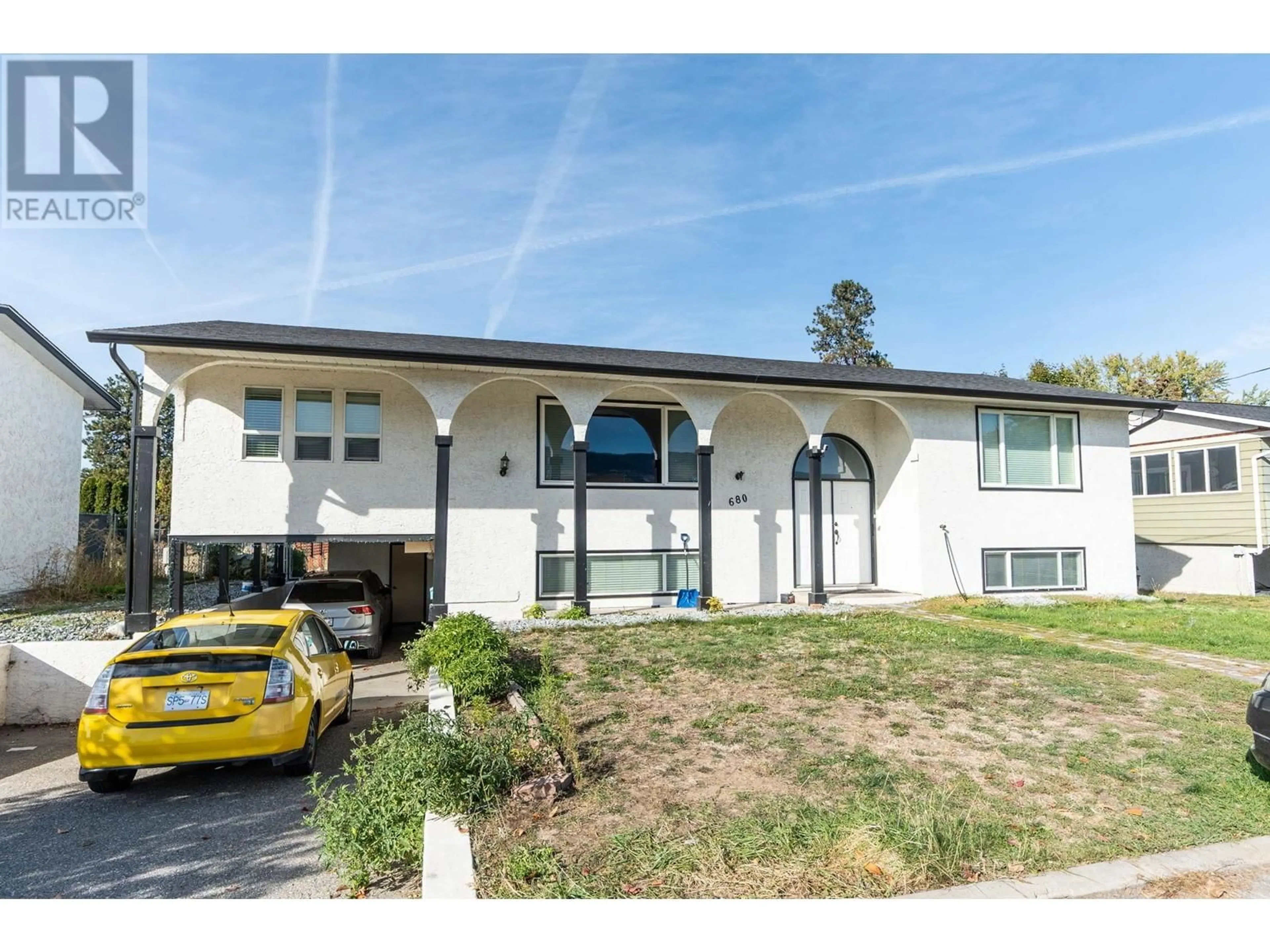 Home with vinyl exterior material, street for 680 TARTAN ROAD, Rutland British Columbia V1X3L3