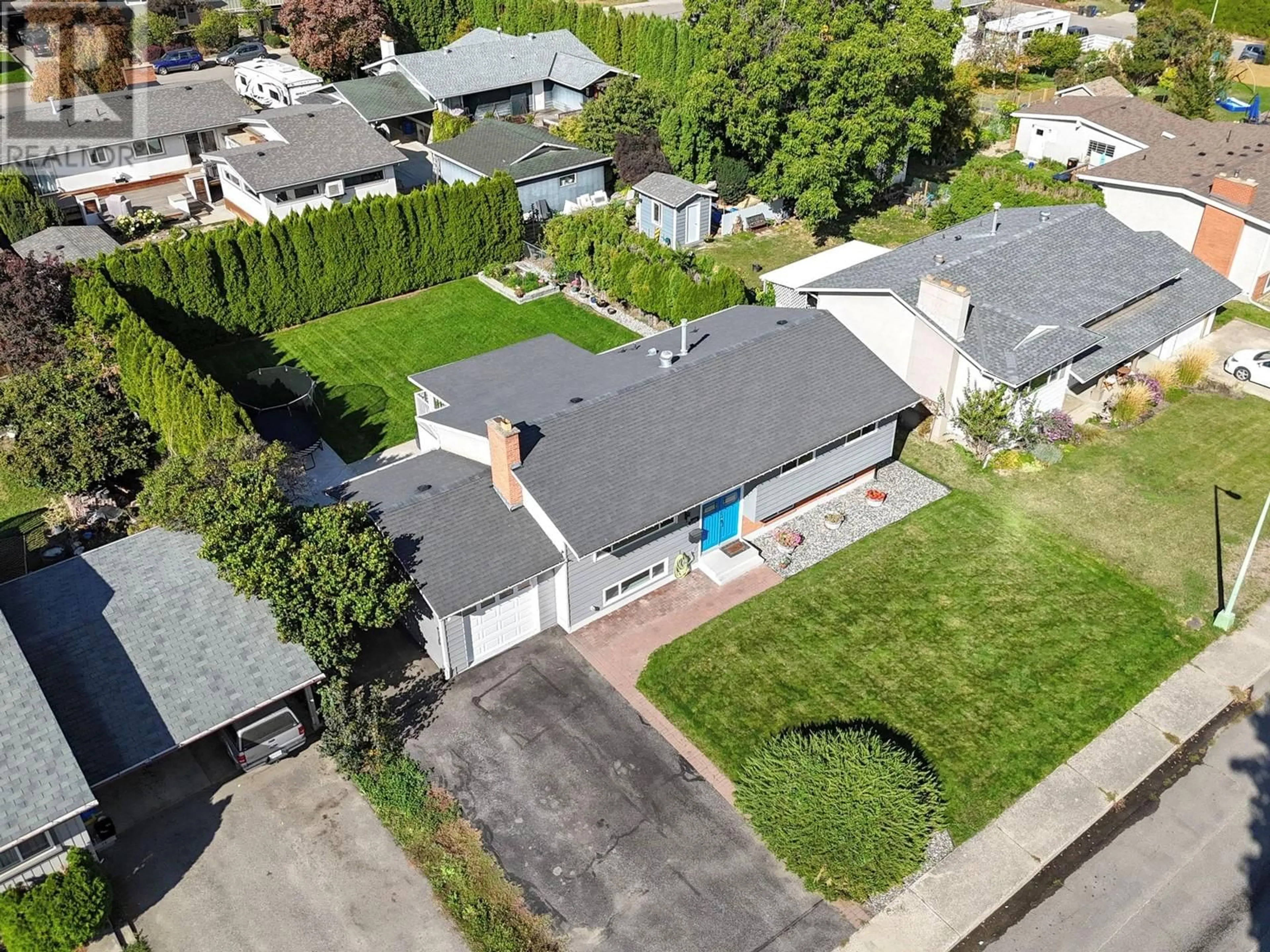 Frontside or backside of a home, the street view for 1408 Richmond Street, Kelowna British Columbia V1Y3T1