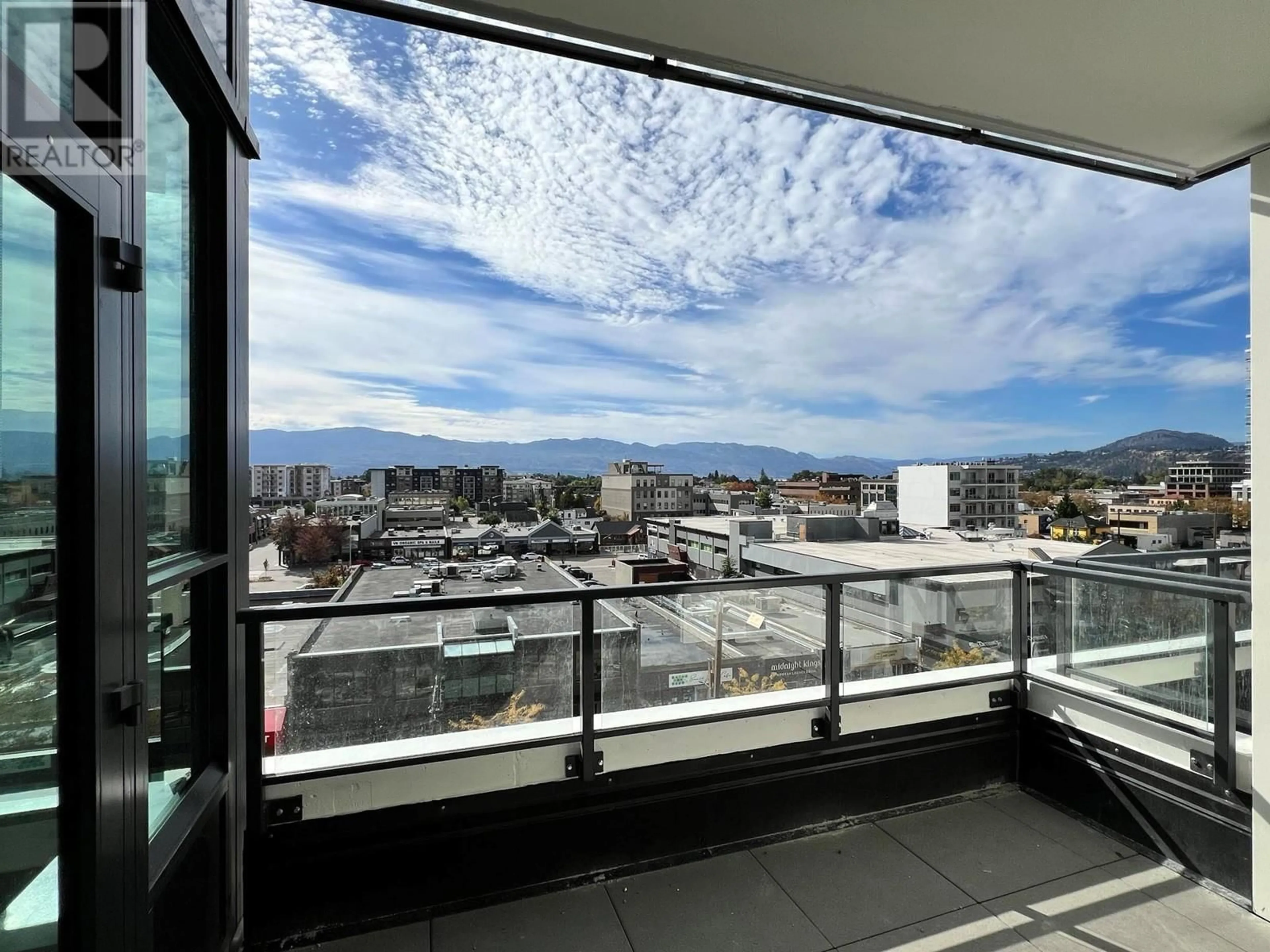 A pic from exterior of the house or condo, the view of mountain for 1488 Bertram Street Unit# 605, Kelowna British Columbia V1Y0M6