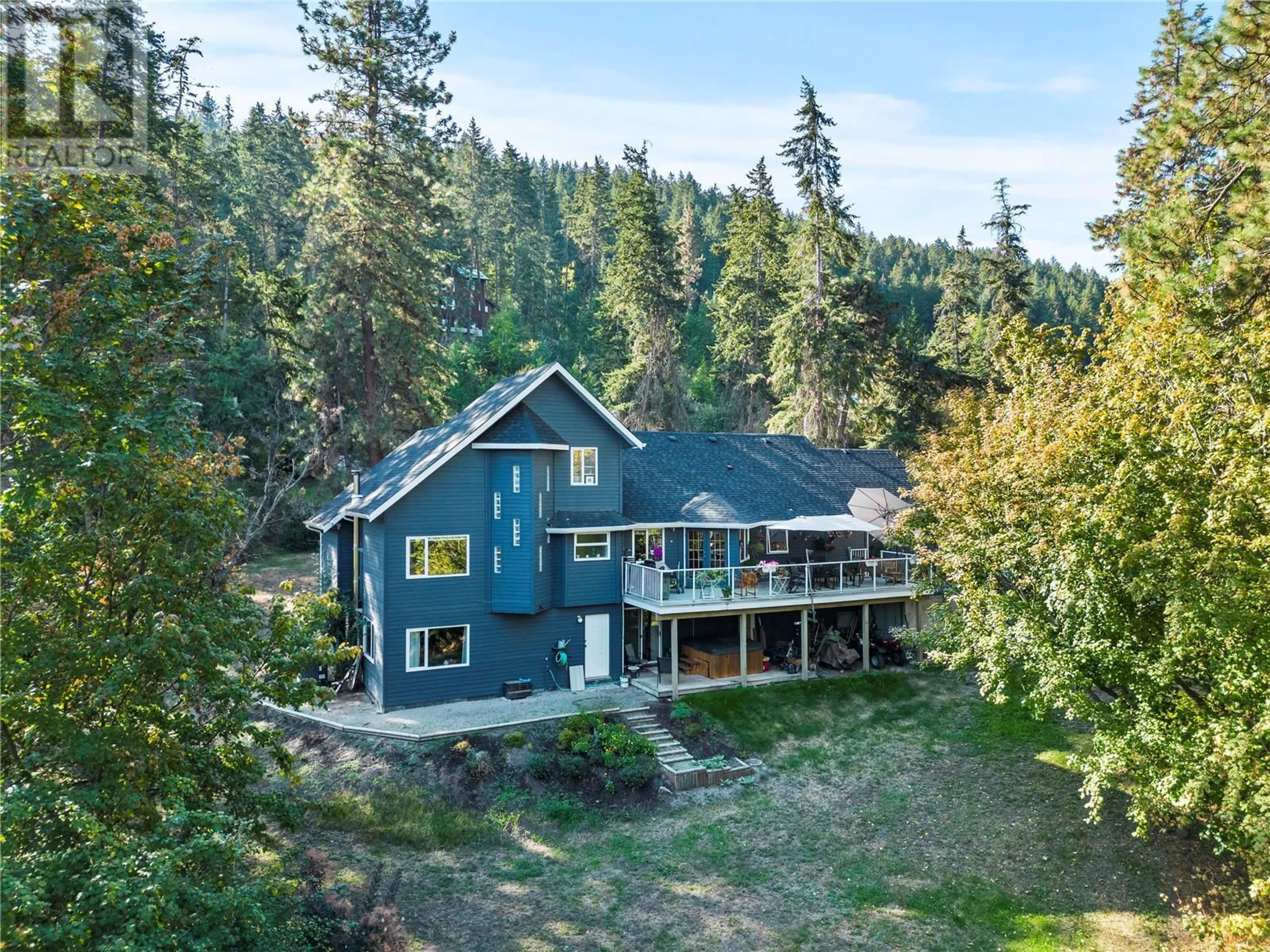 A pic from outside/outdoor area/front of a property/back of a property/a pic from drone, unknown for 9292 KOKANEE ROAD, Vernon British Columbia V1H1K4