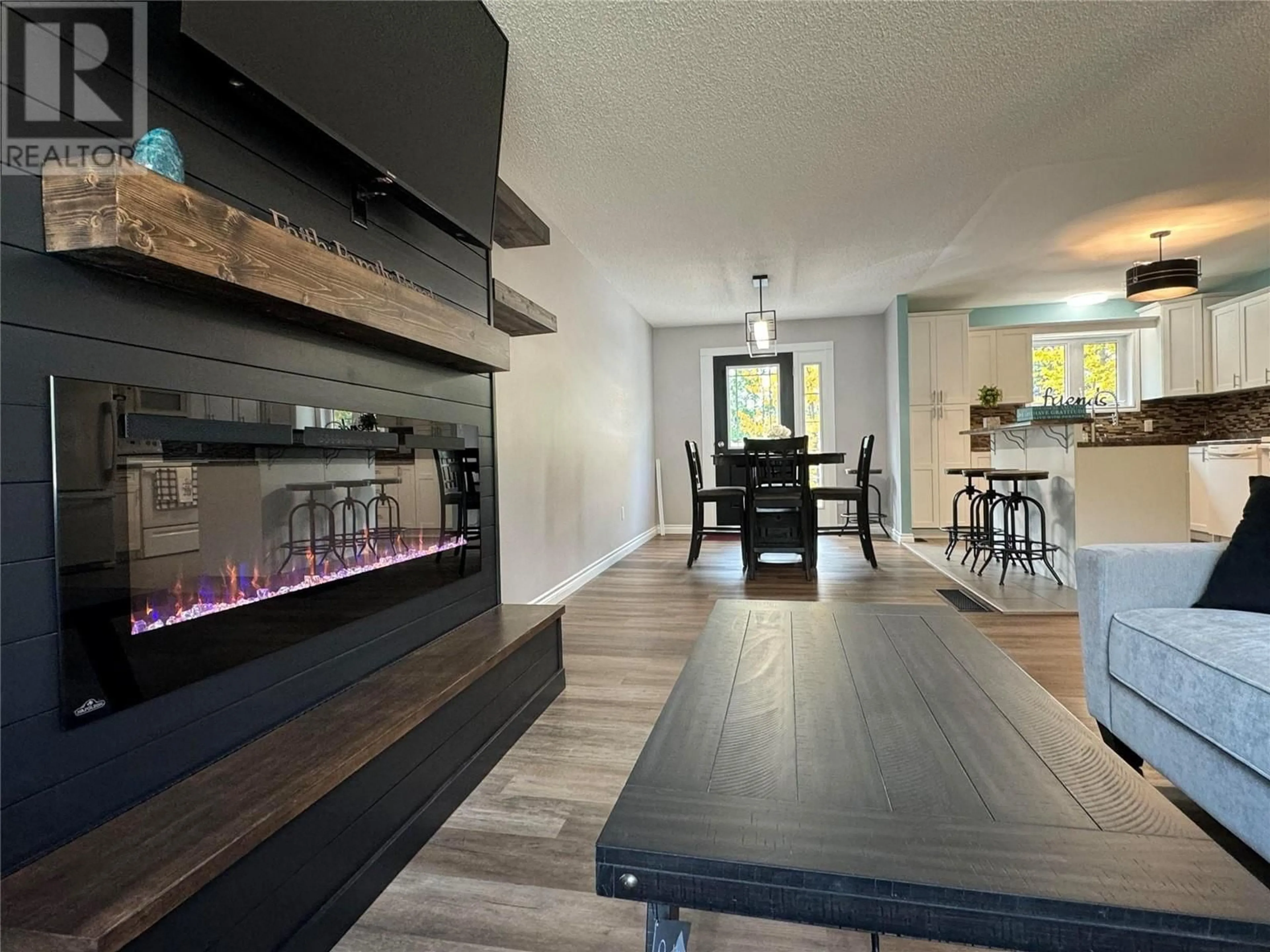 Open concept kitchen, wood/laminate floor for 115 Wolverine Avenue, Tumbler Ridge British Columbia V0C2W0