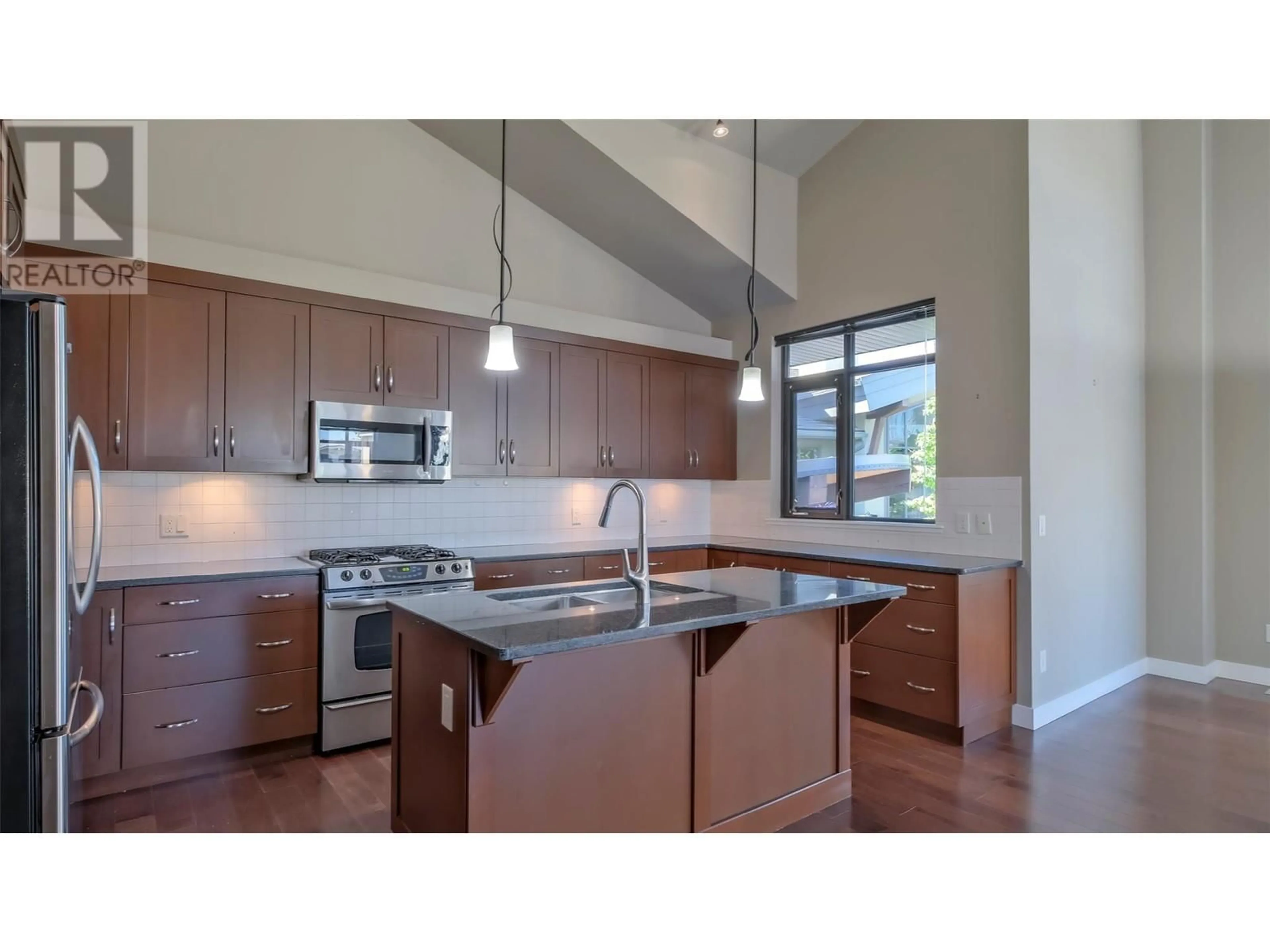 Open concept kitchen for 600 Sarsons Road Unit# 202, Kelowna British Columbia V1W5H5