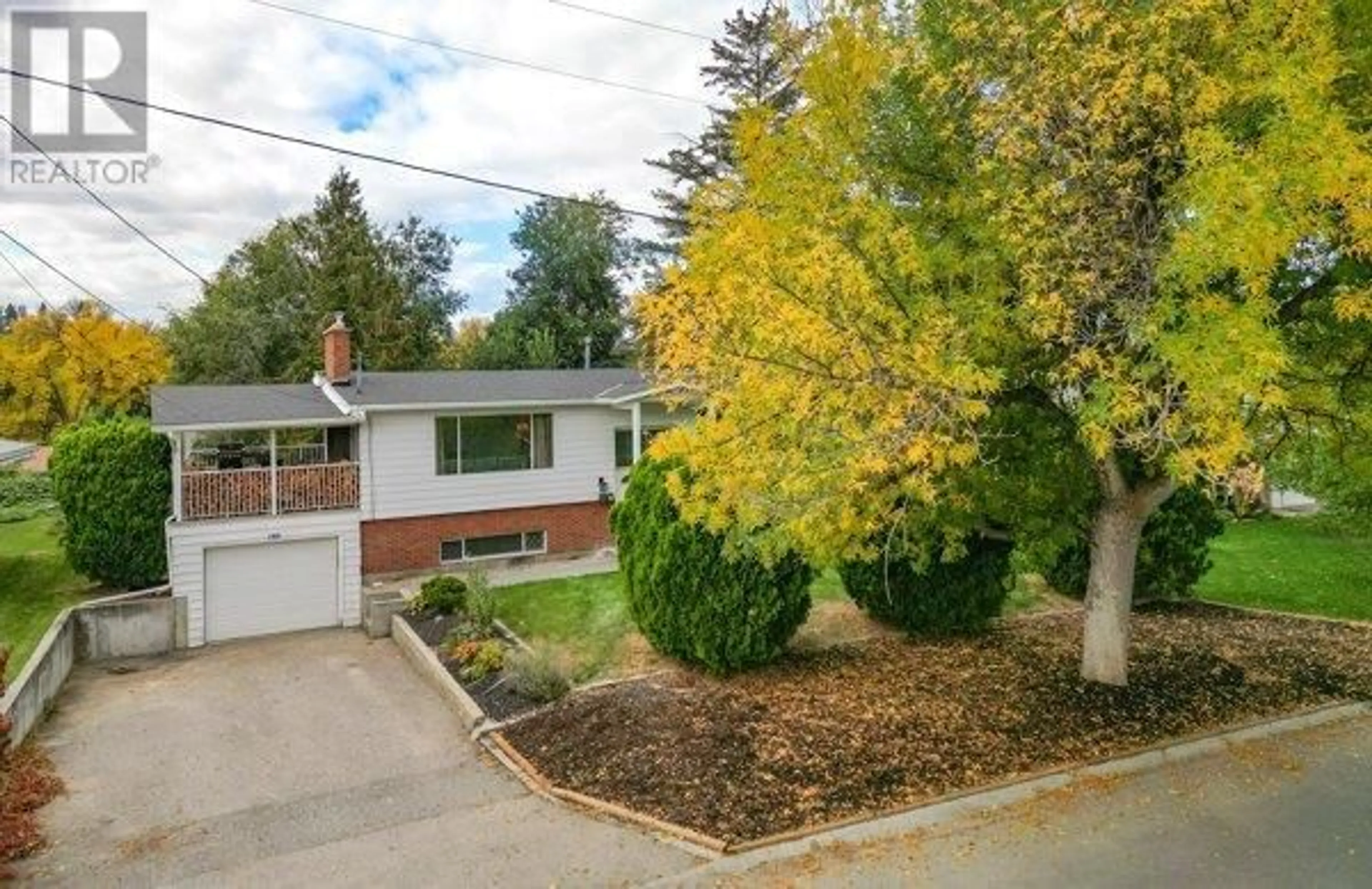 A pic from exterior of the house or condo, the fenced backyard for 830 Matt Road, Kelowna British Columbia V1X3W3