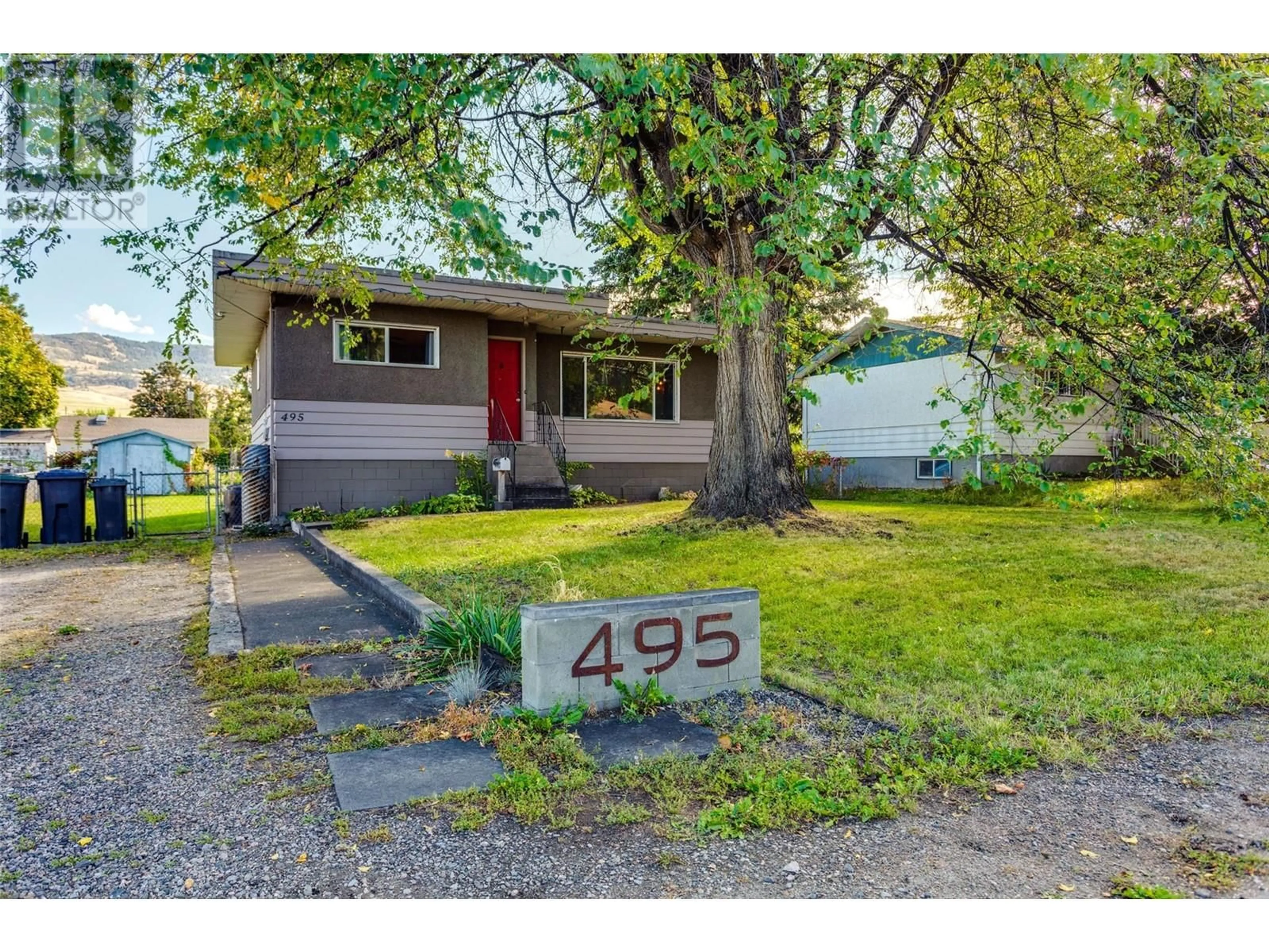 Frontside or backside of a home, the street view for 495 Donhauser Road, Kelowna British Columbia V1X3G2