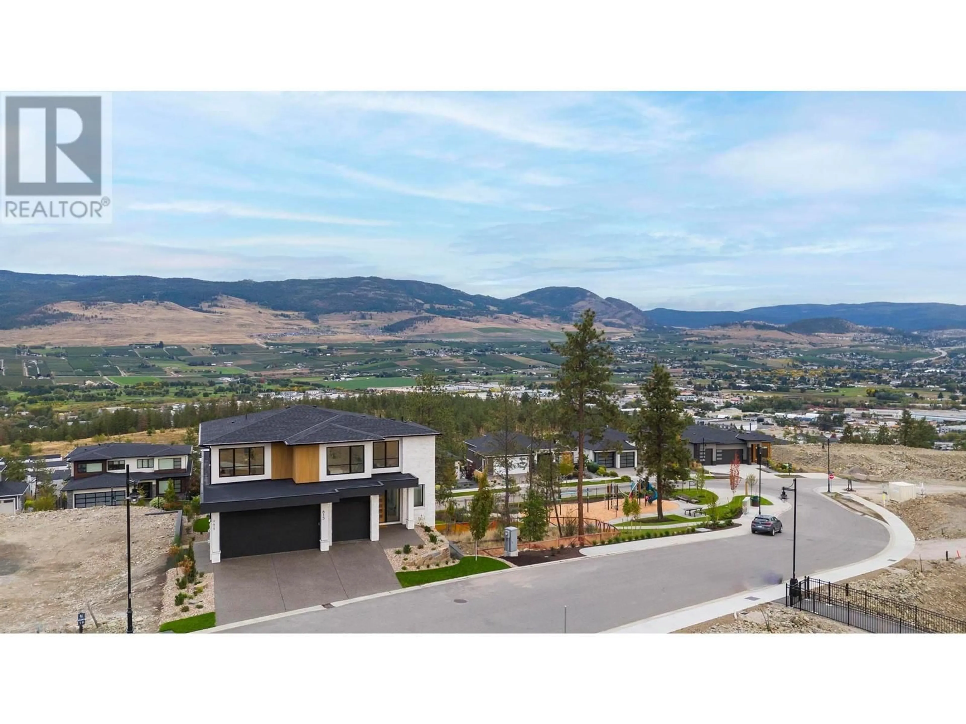 A pic from outside/outdoor area/front of a property/back of a property/a pic from drone, mountain view for 615 KINGSWOOD TERRACE, Kelowna British Columbia V1V0J2