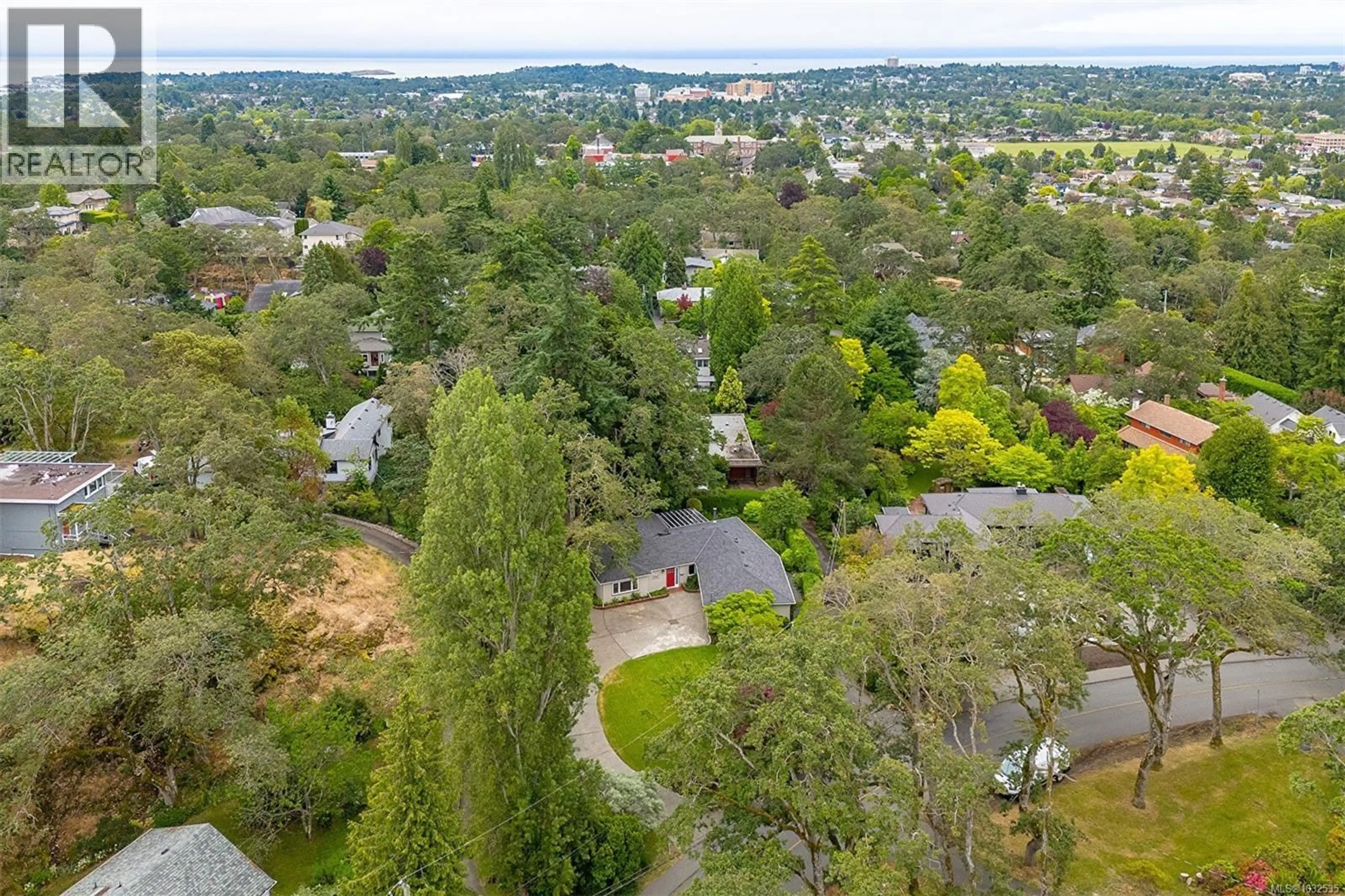 A pic from outside/outdoor area/front of a property/back of a property/a pic from drone, forest/trees view for 1941 MAYFAIR DRIVE, Saanich British Columbia V8P1R1
