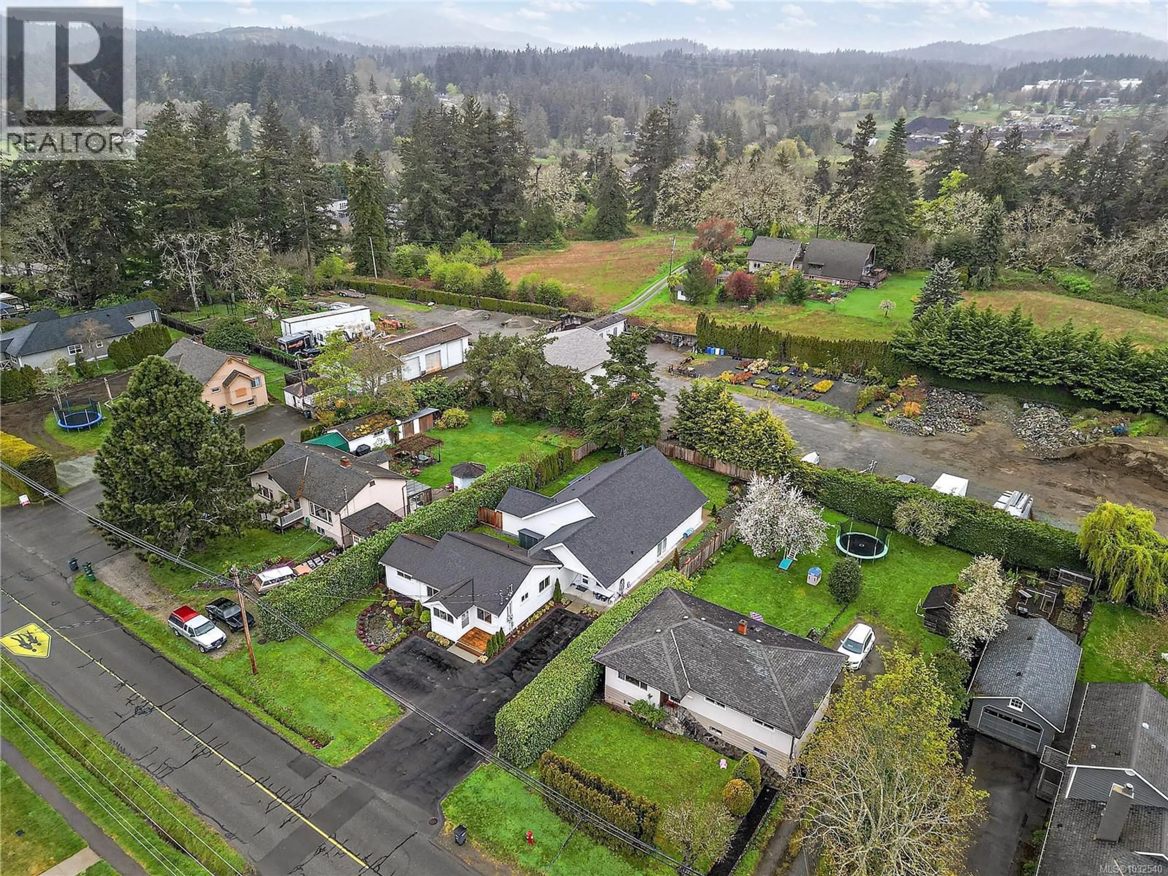 A pic from outside/outdoor area/front of a property/back of a property/a pic from drone, mountain view for 1360 HASTINGS STREET, Saanich British Columbia V8Z2W2