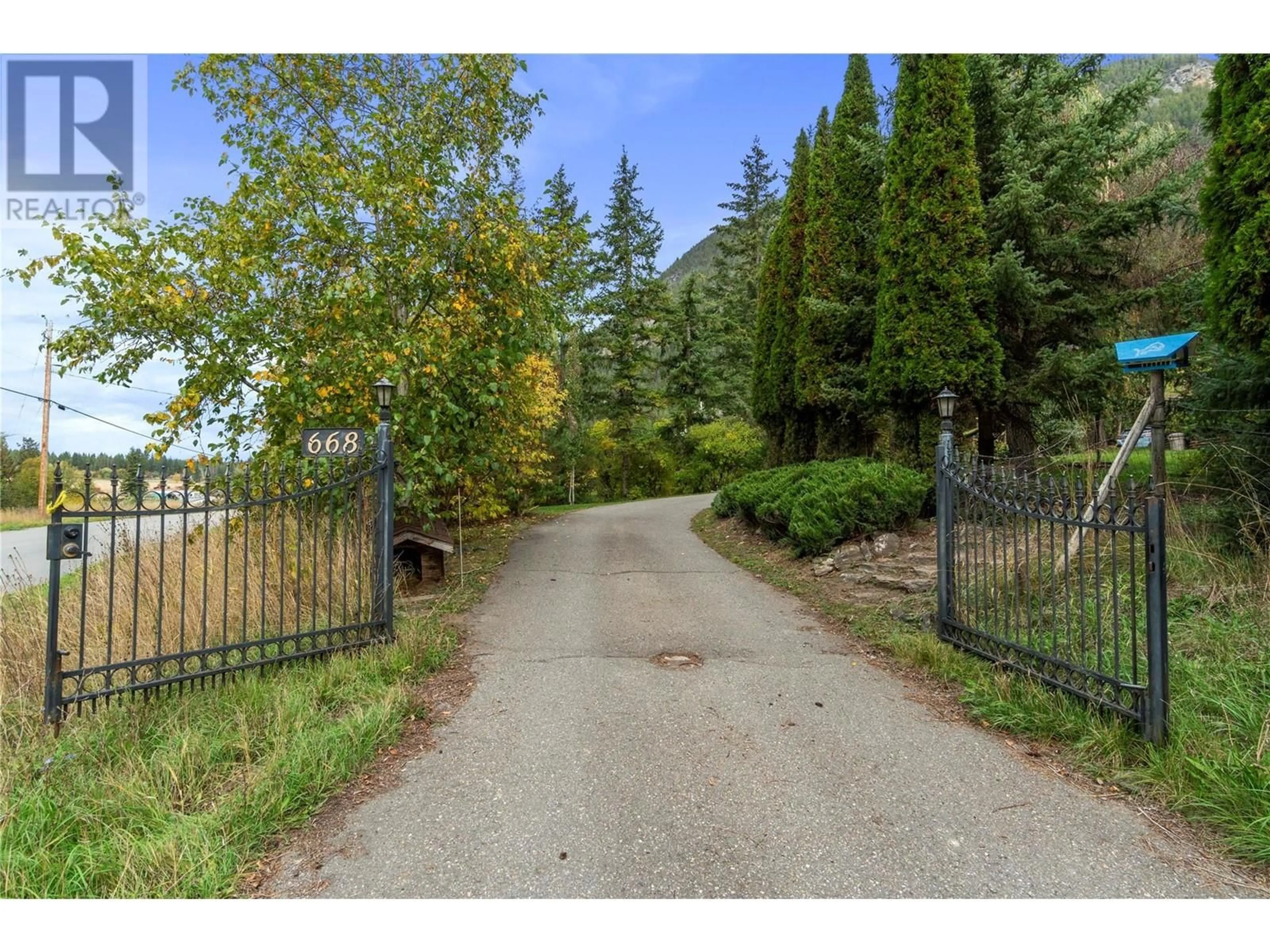 A pic from exterior of the house or condo, the fenced backyard for 668 Mobley Road, Tappen British Columbia V0E2X1