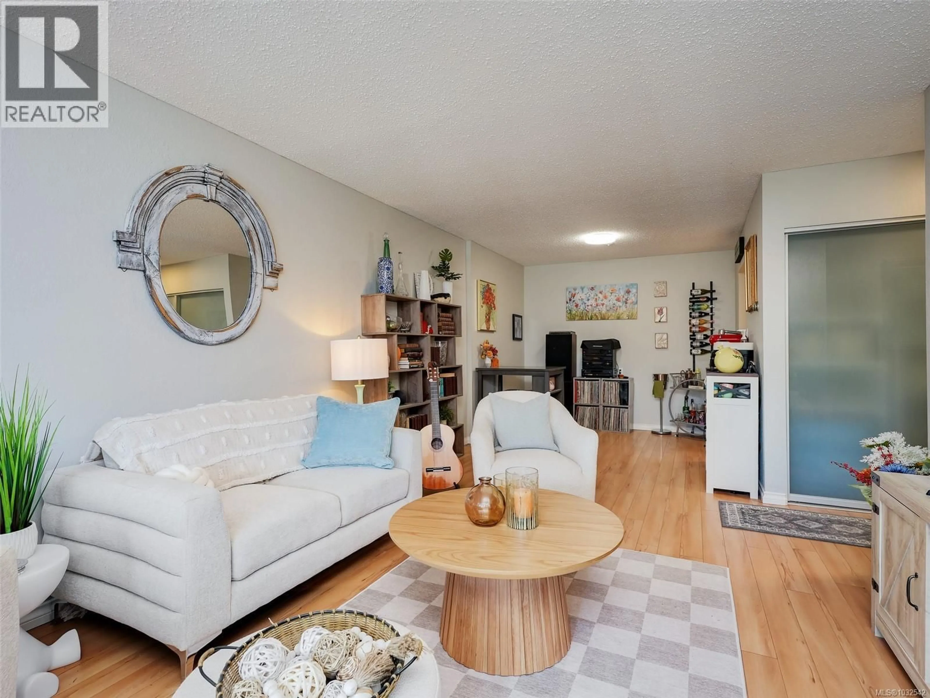 Living room with furniture, wood/laminate floor for 304 - 1537 MORRISON STREET, Victoria British Columbia V8R4K1