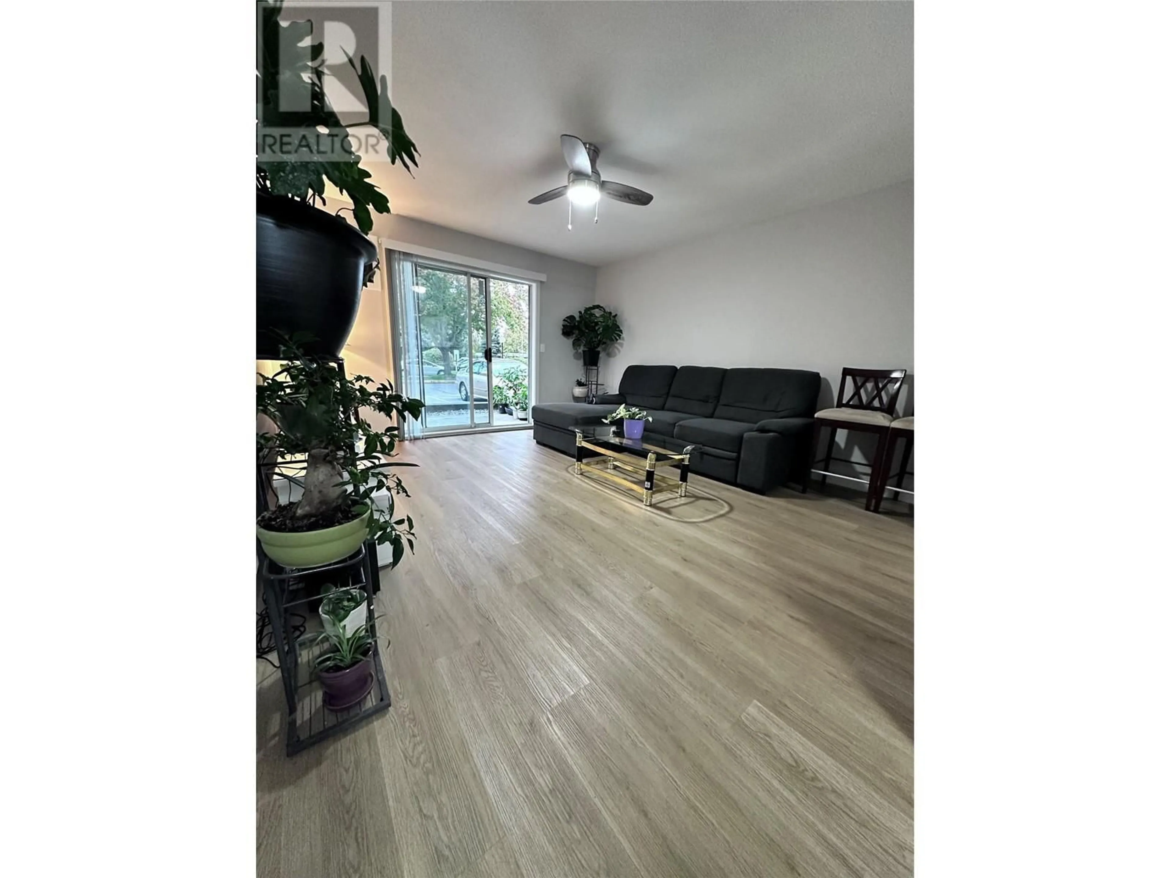 Living room, wood floors for 3180 De Montreuil Court Unit# 108, Kelowna British Columbia V1W3W4