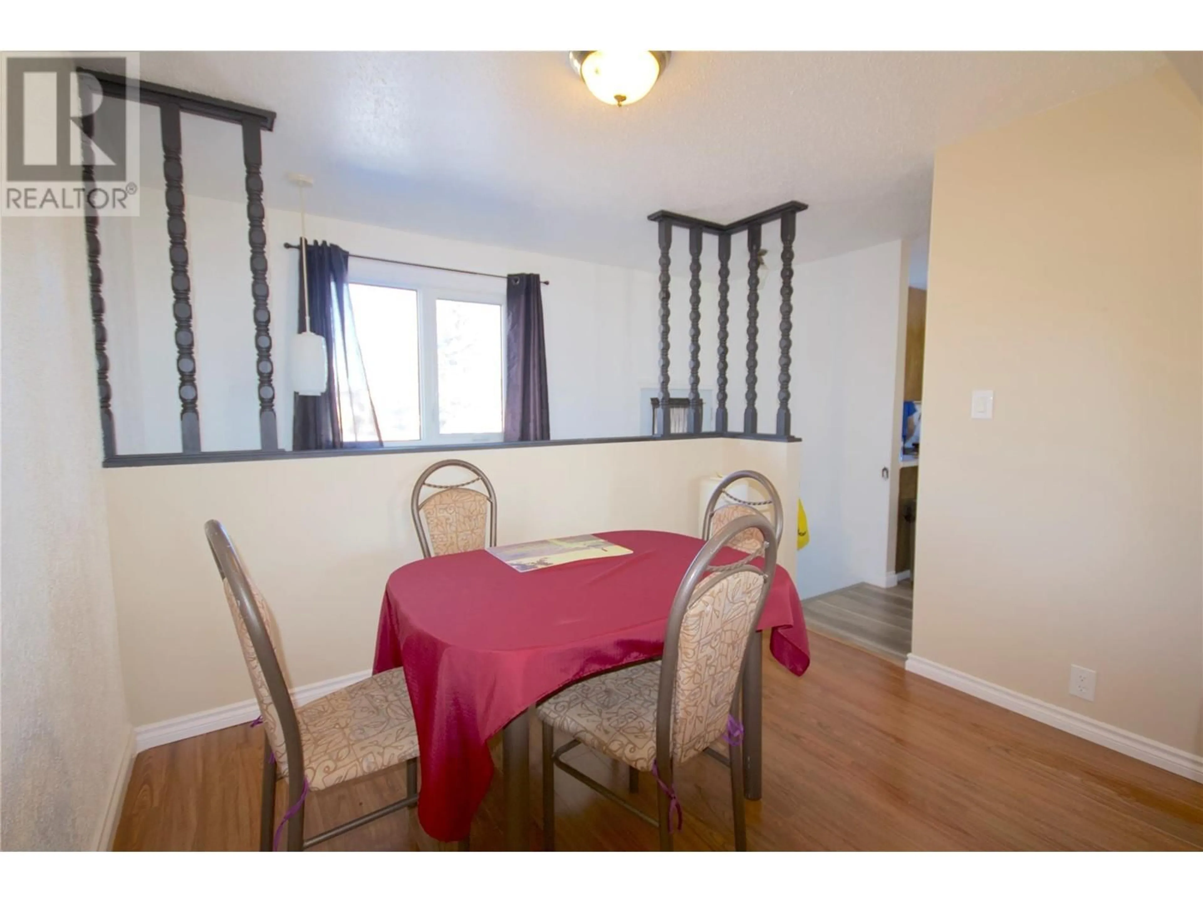 Dining room, wood/laminate floor for 1828 108 AVENUE, Dawson Creek British Columbia V1G2T8