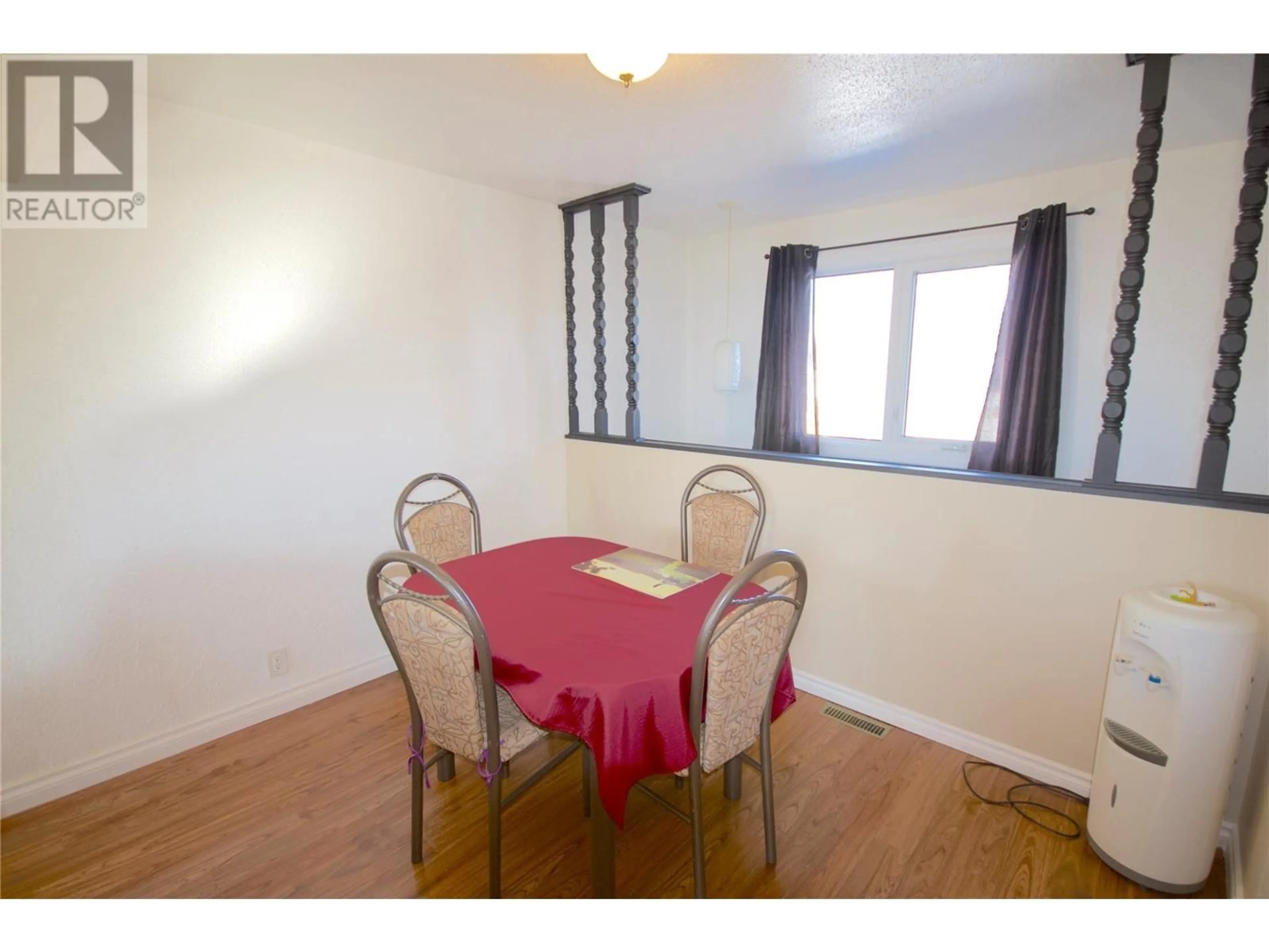 Dining room, wood/laminate floor for 1828 108 AVENUE, Dawson Creek British Columbia V1G2T8
