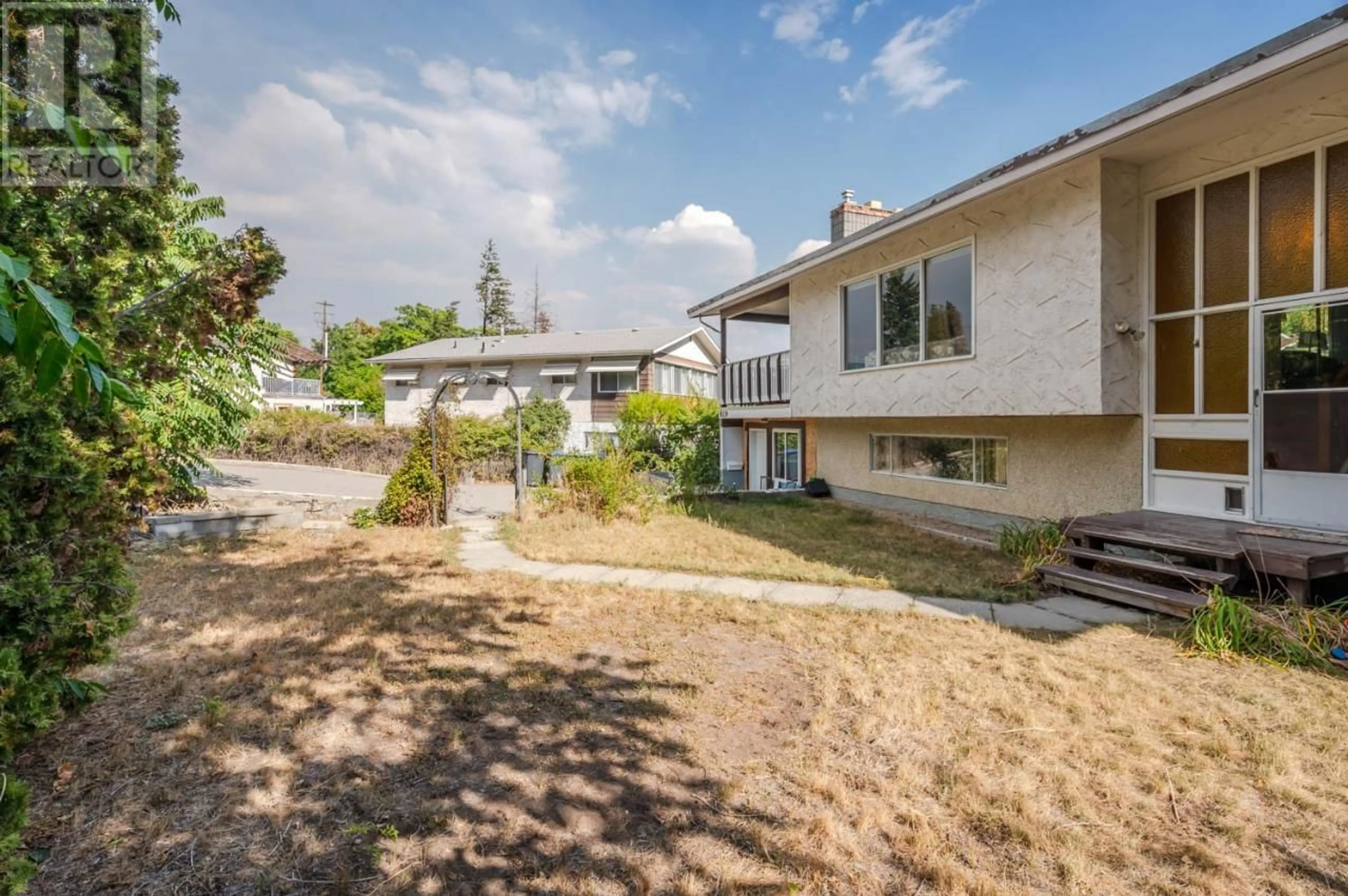 Frontside or backside of a home, the fenced backyard for 8119 Purves Road, Summerland British Columbia V0H1Z5