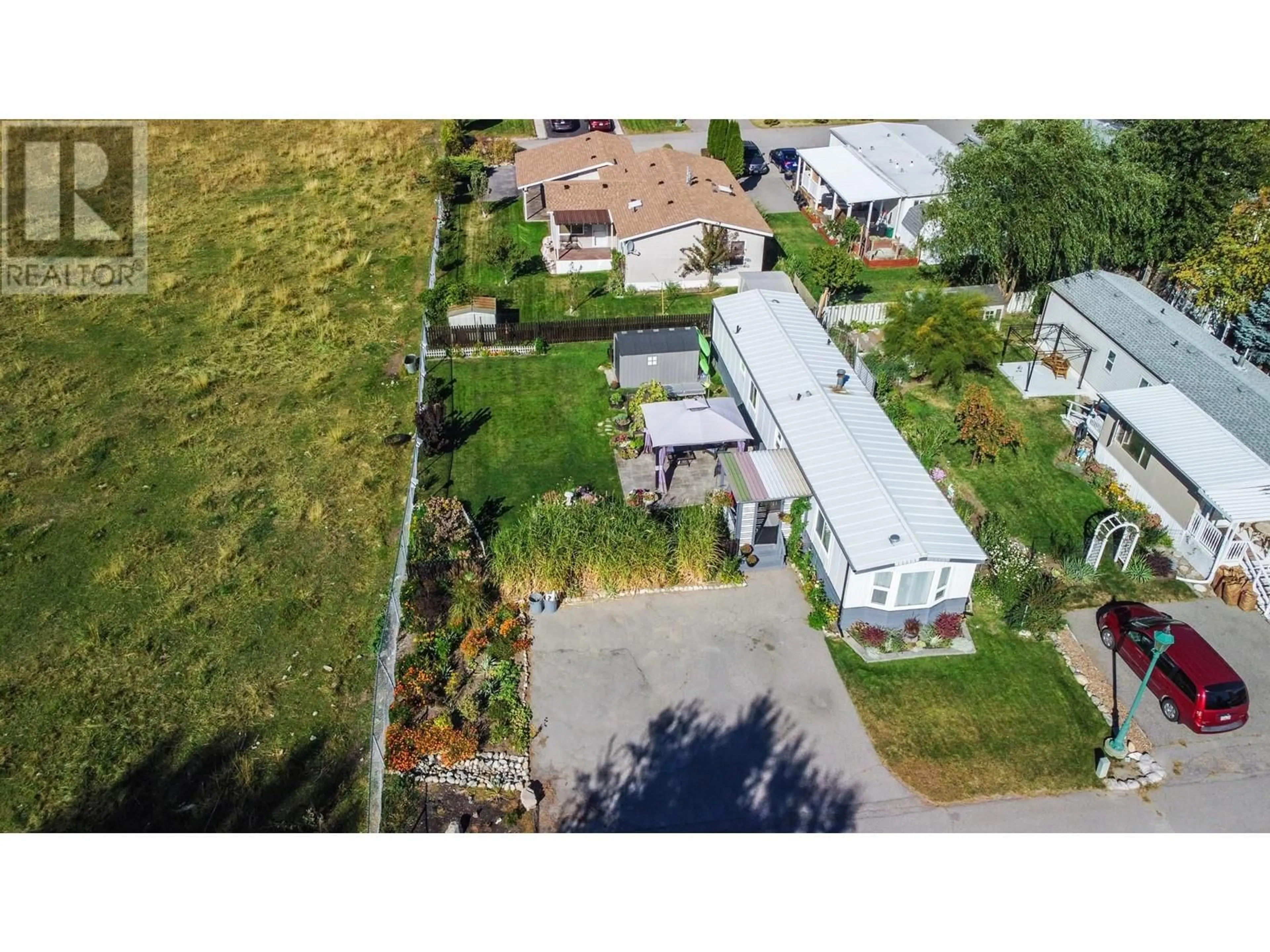 A pic from outside/outdoor area/front of a property/back of a property/a pic from drone, street for 4505 McLean Creek Road Unit# L2, Okanagan Falls British Columbia V0H1R1