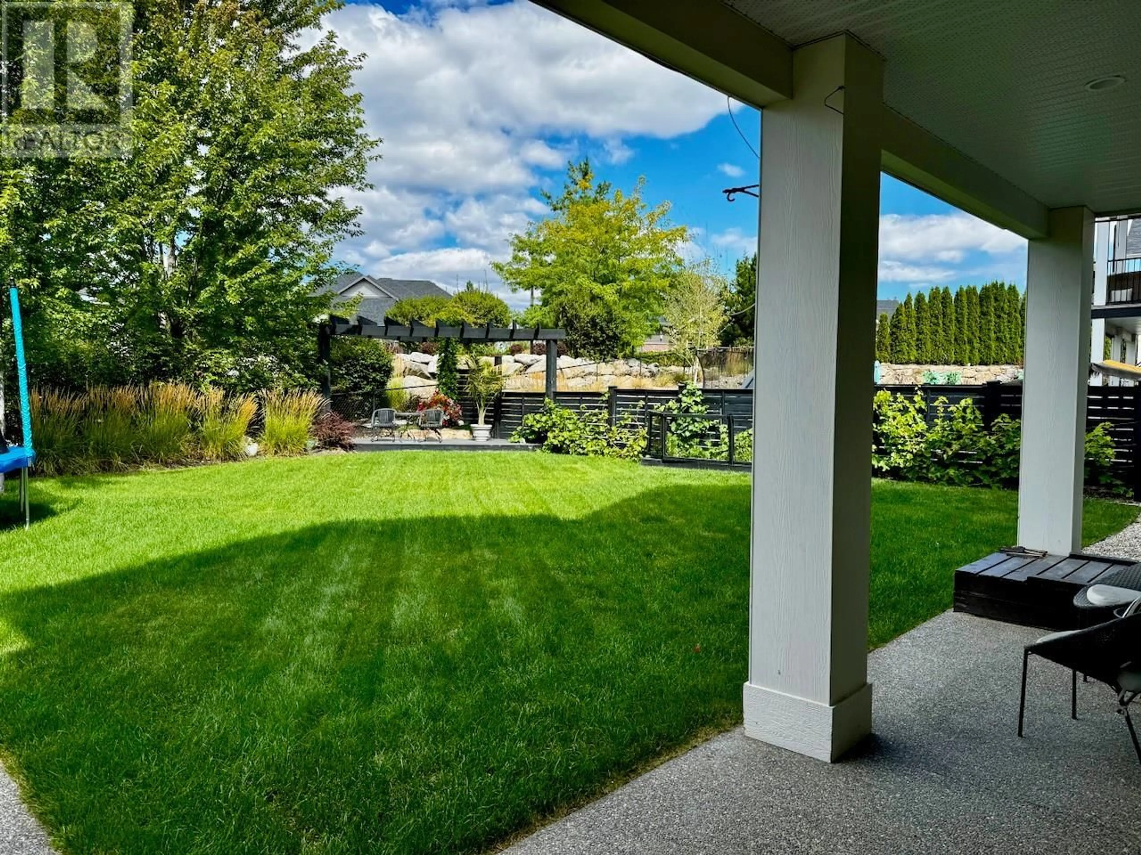 Patio, the fenced backyard for 515 Wren Place Unit# 126, Kelowna British Columbia V1W5H7