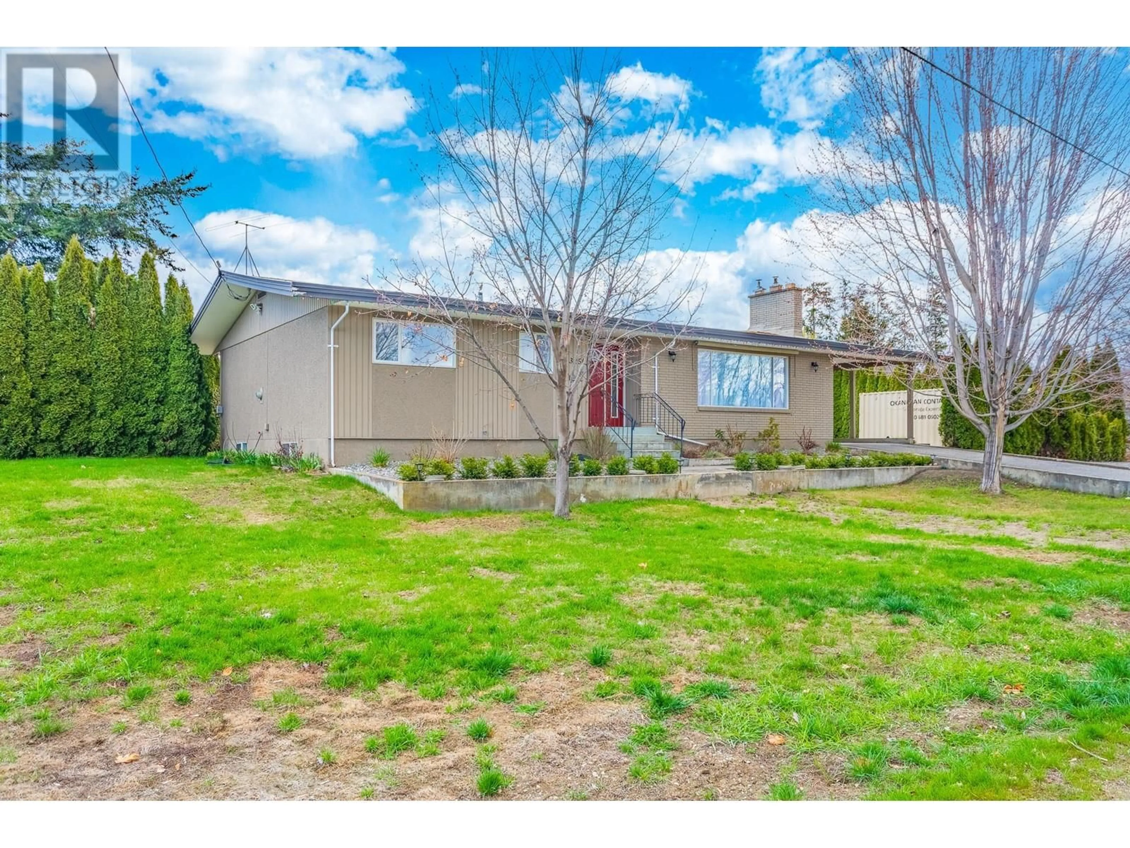 Frontside or backside of a home, the fenced backyard for 3259 St. Amand Road, Kelowna British Columbia V1W3P2