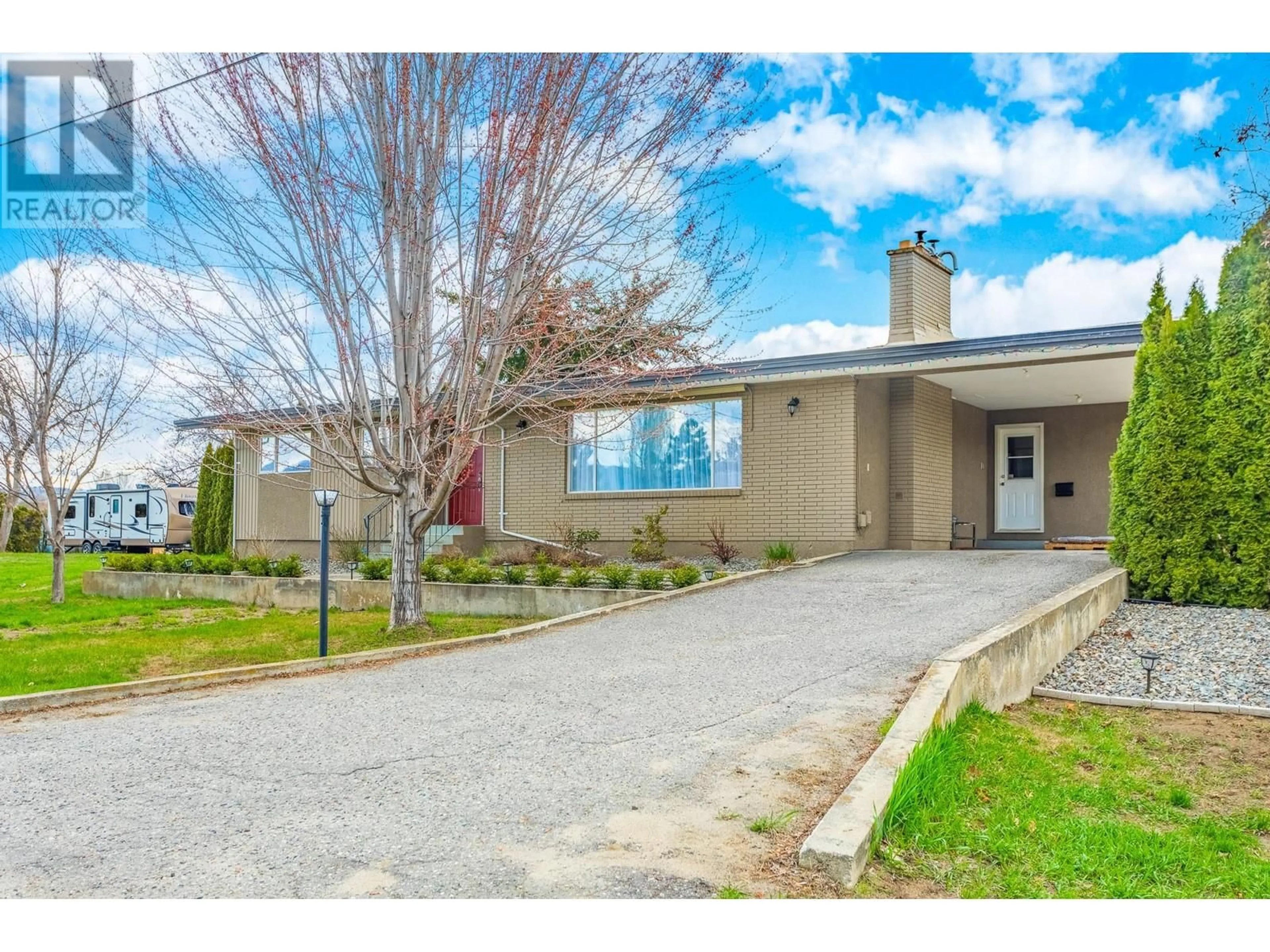 Frontside or backside of a home, the street view for 3259 St. Amand Road, Kelowna British Columbia V1W3P2