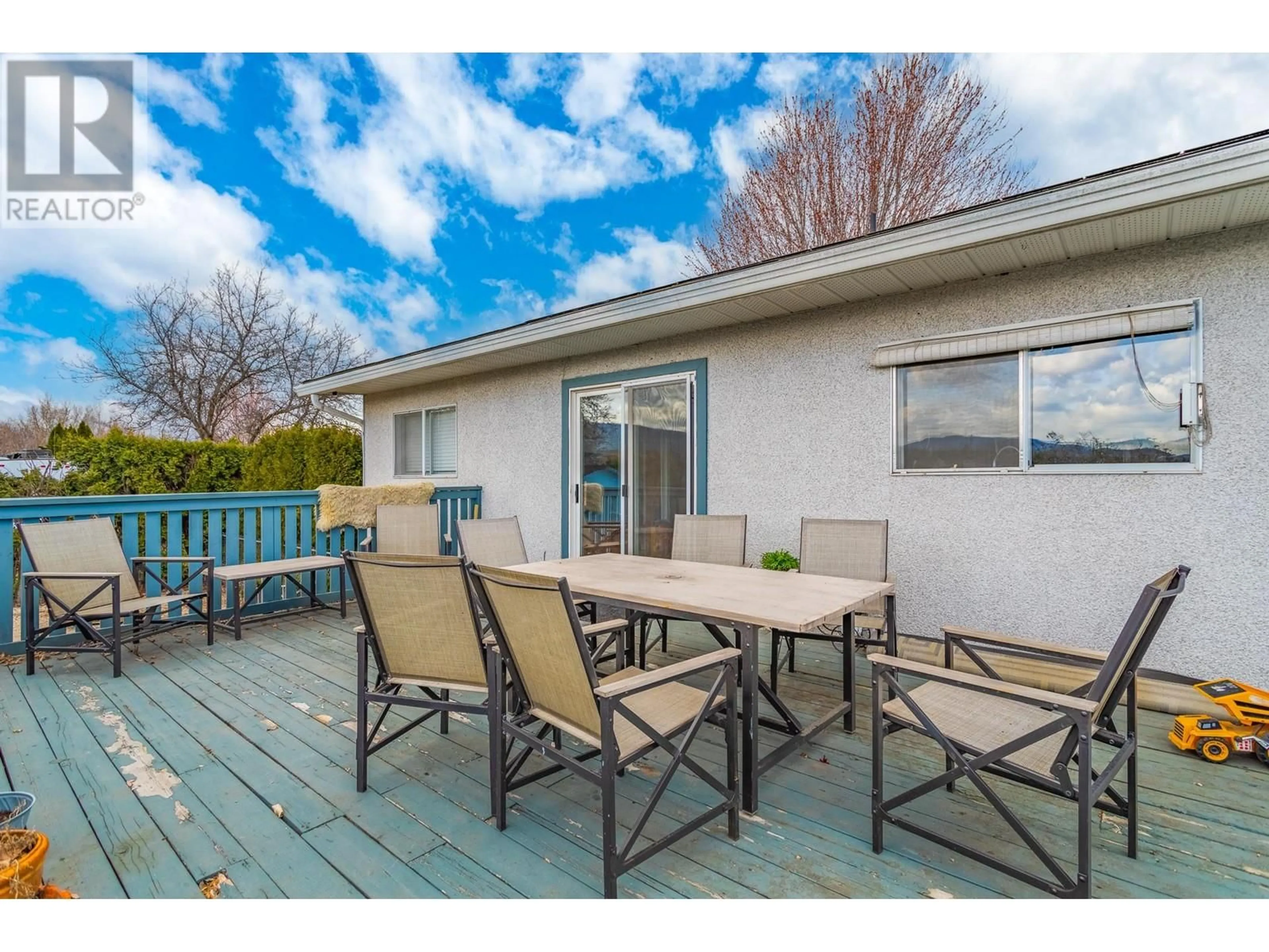 Patio, the fenced backyard for 3249 St. Amand Road, Kelowna British Columbia V1W3P2