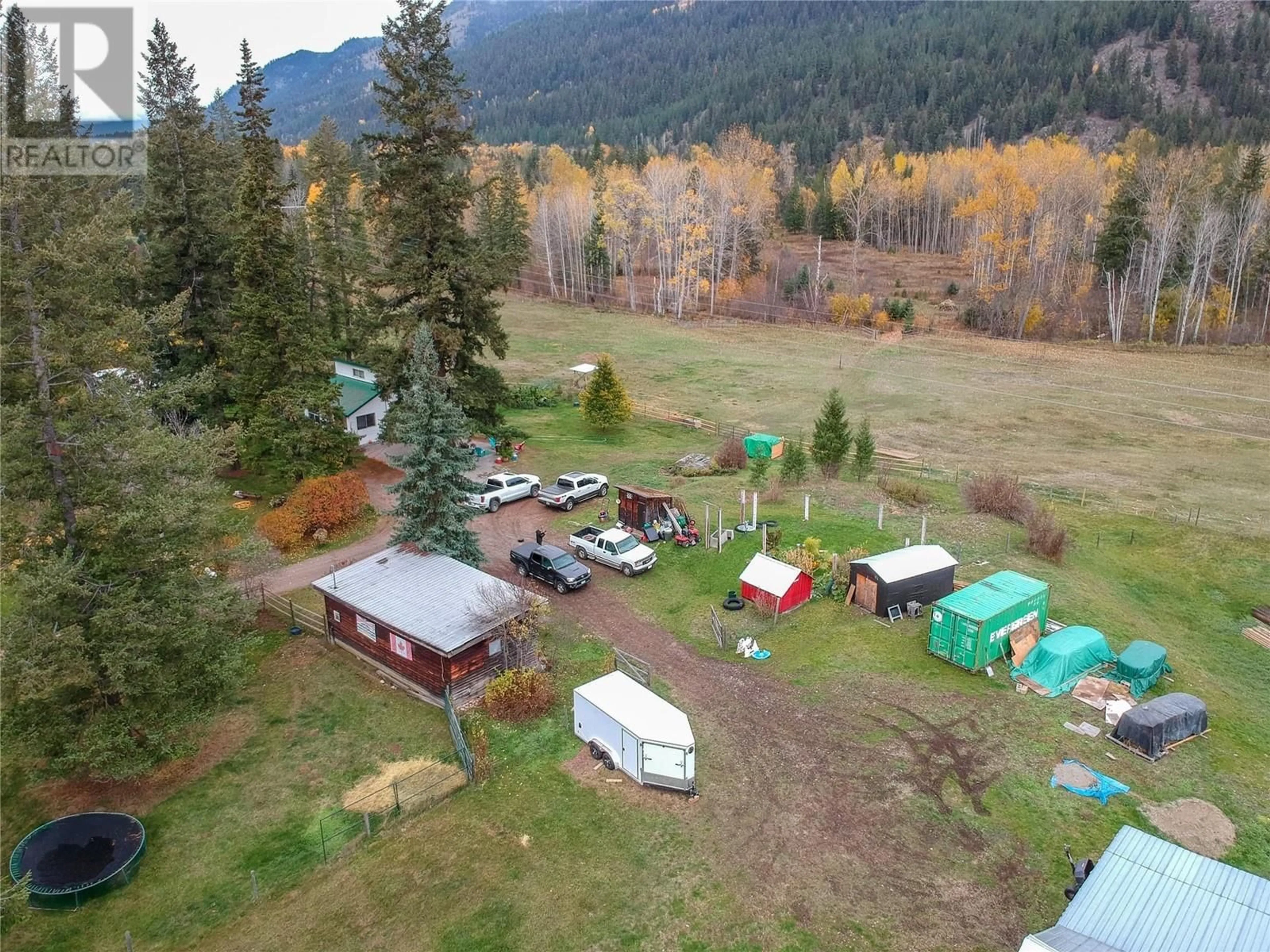 A pic from outside/outdoor area/front of a property/back of a property/a pic from drone, mountain view for 1385 6 HIGHWAY, Cherryville British Columbia V0E2G1