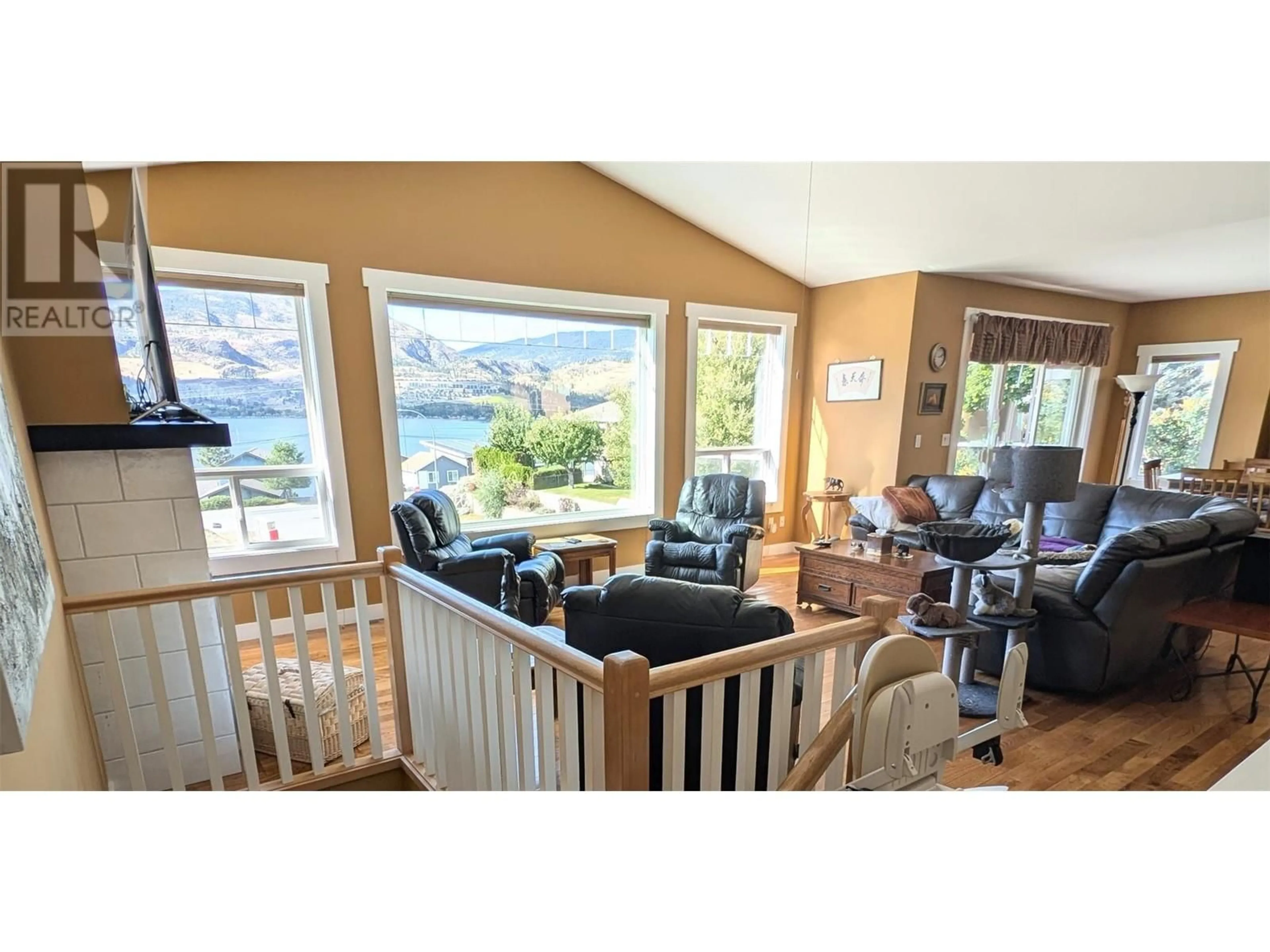 Living room with furniture, wood/laminate floor for 4000 FINNERTY ROAD, Penticton British Columbia V2A8W2