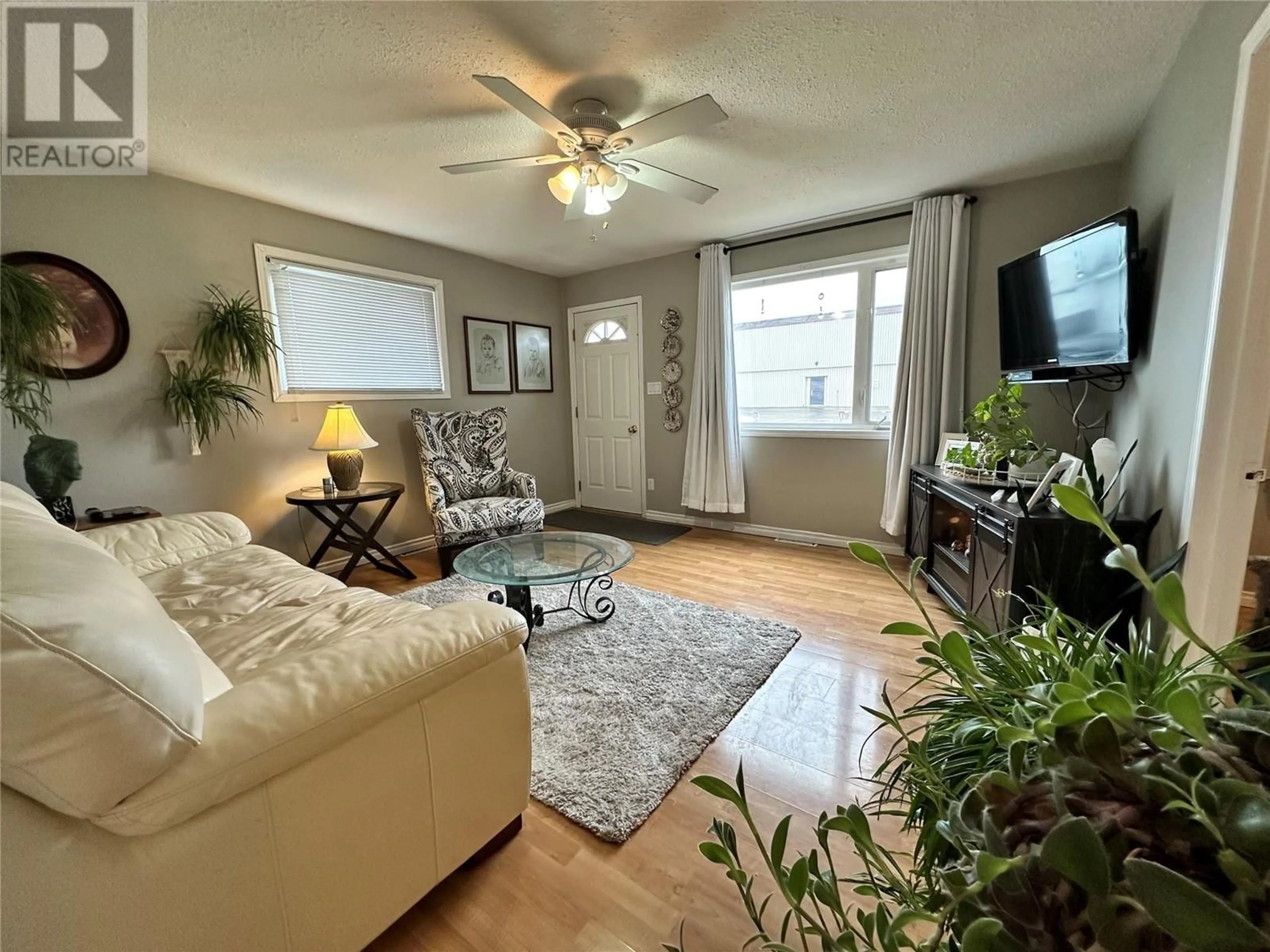 Living room, wood floors for 1920 110 Avenue, Dawson Creek British Columbia V1G2W7