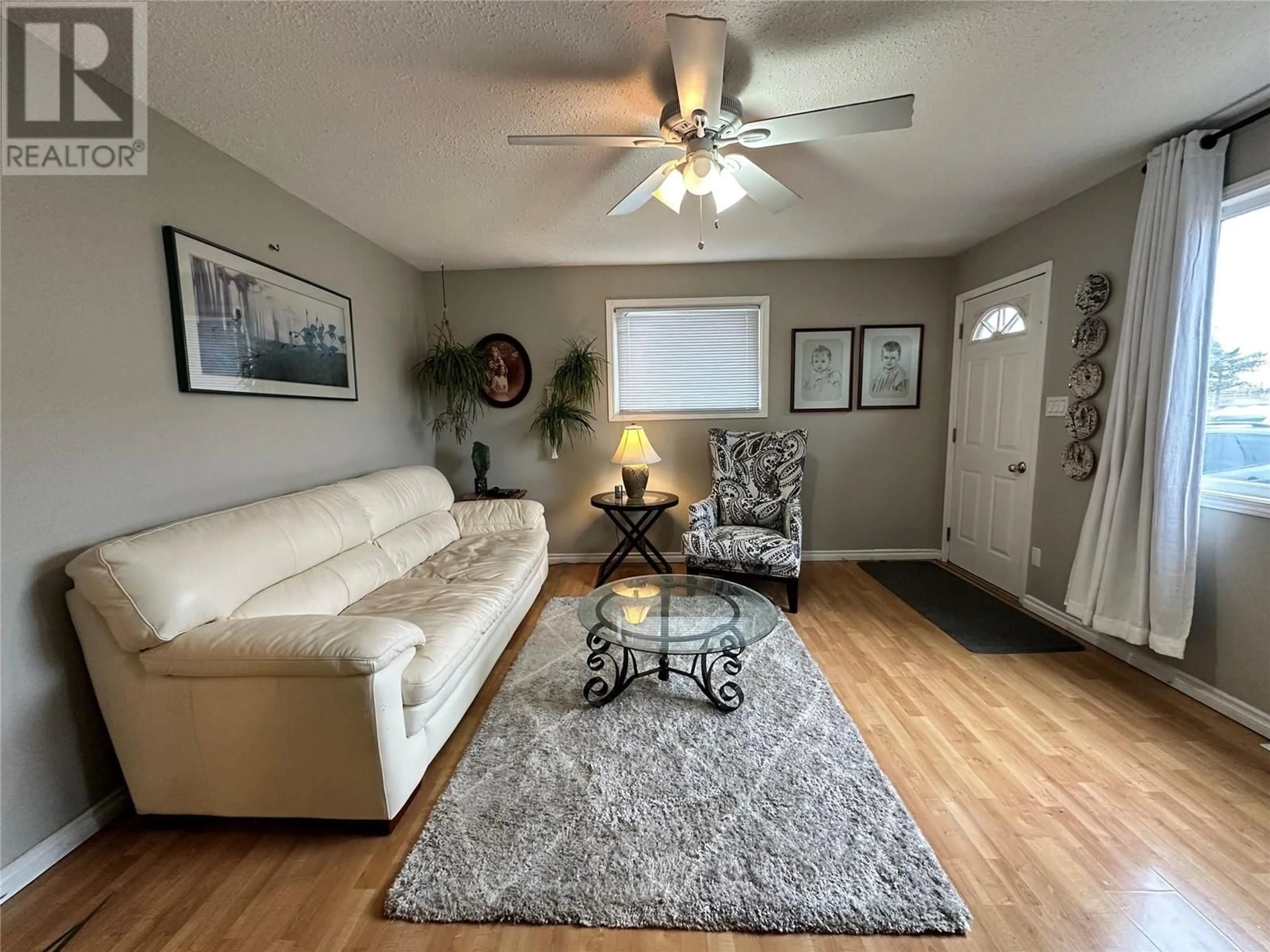 Living room, wood floors for 1920 110 Avenue, Dawson Creek British Columbia V1G2W7