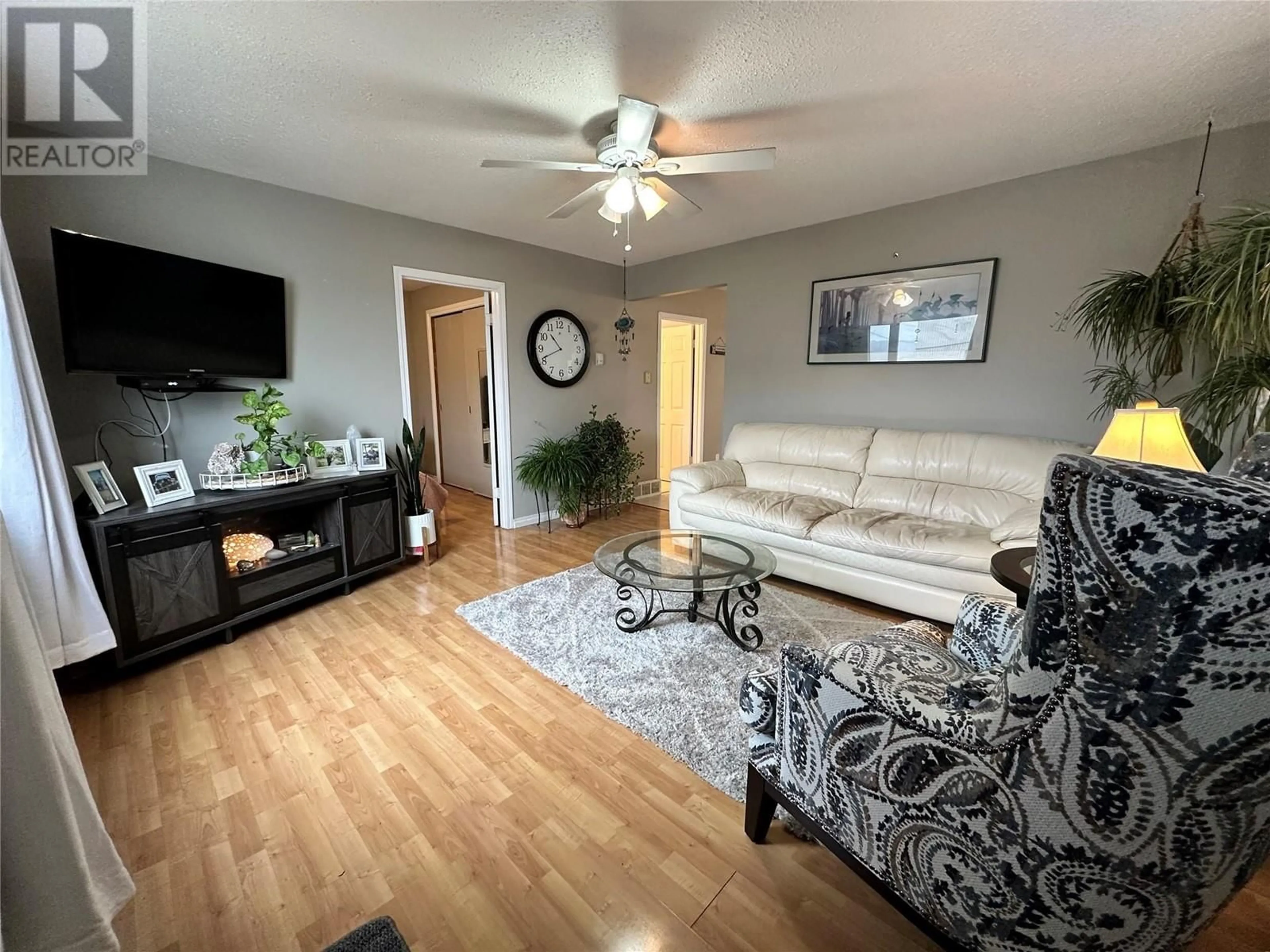 A pic of a room, wood floors for 1920 110 Avenue, Dawson Creek British Columbia V1G2W7