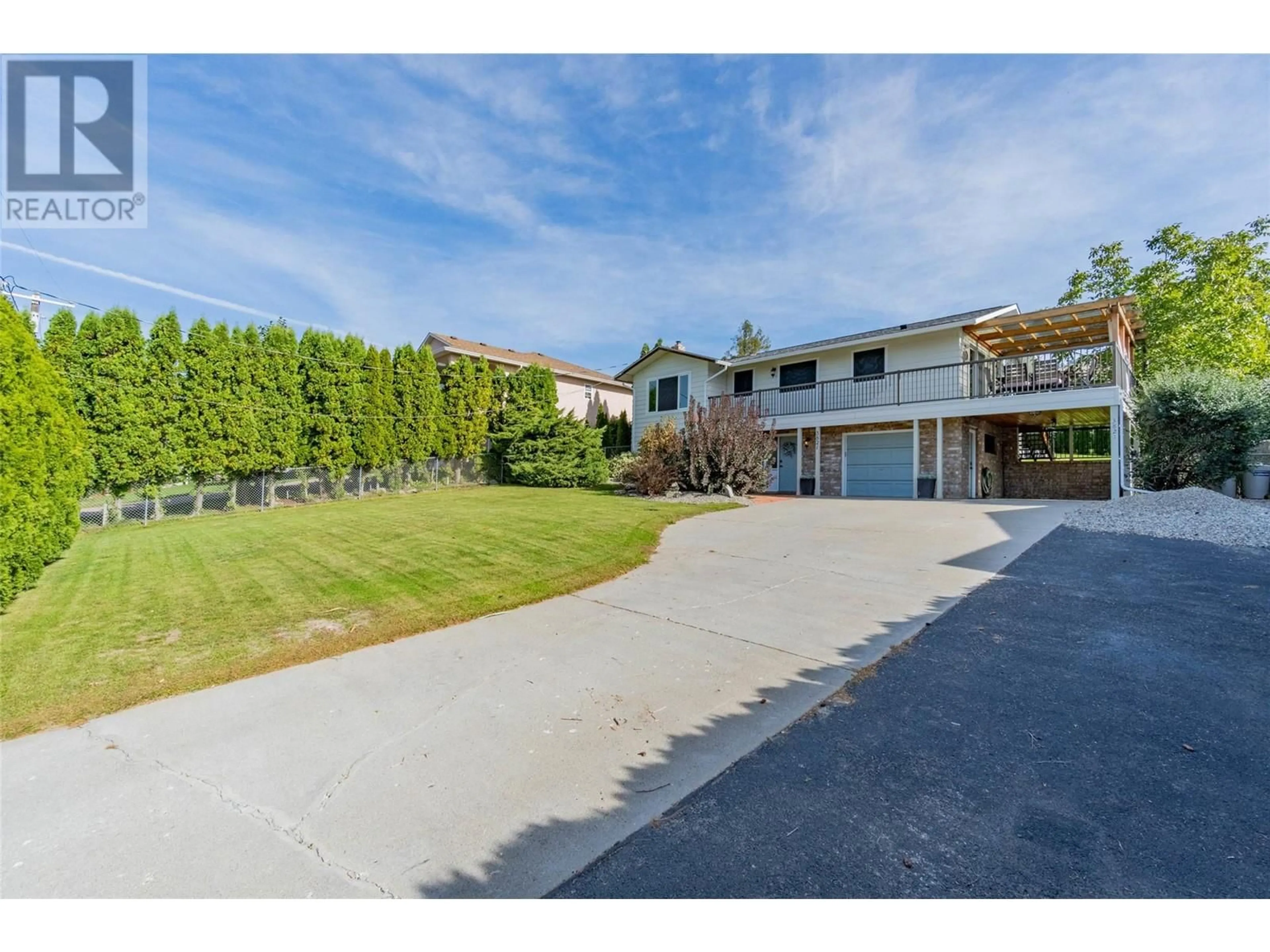 Frontside or backside of a home, the fenced backyard for 3821 35TH Street, Osoyoos British Columbia V0H1V6