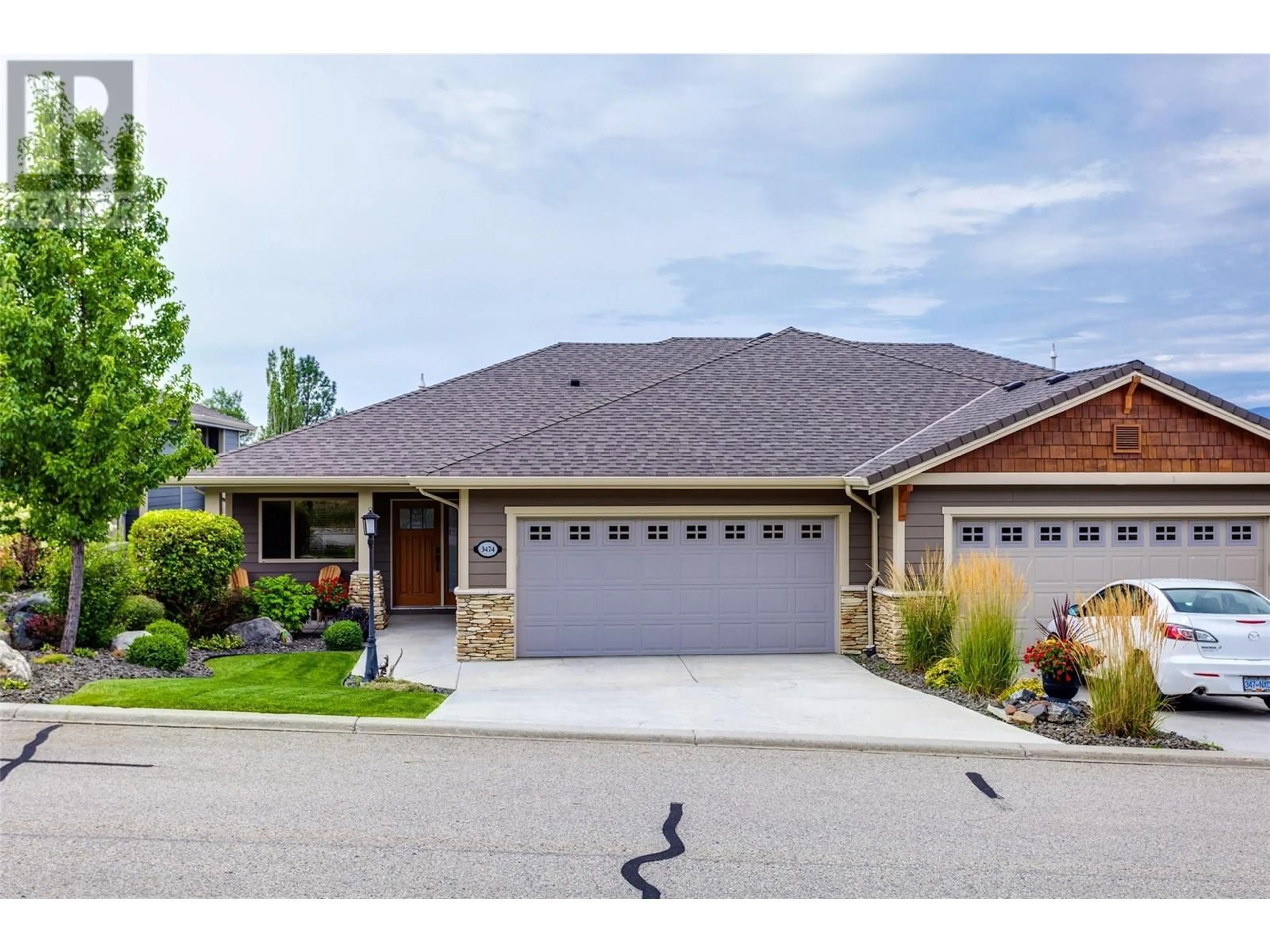 Frontside or backside of a home, the street view for 3474 Pine Valley Drive, Kelowna British Columbia V1X8E3