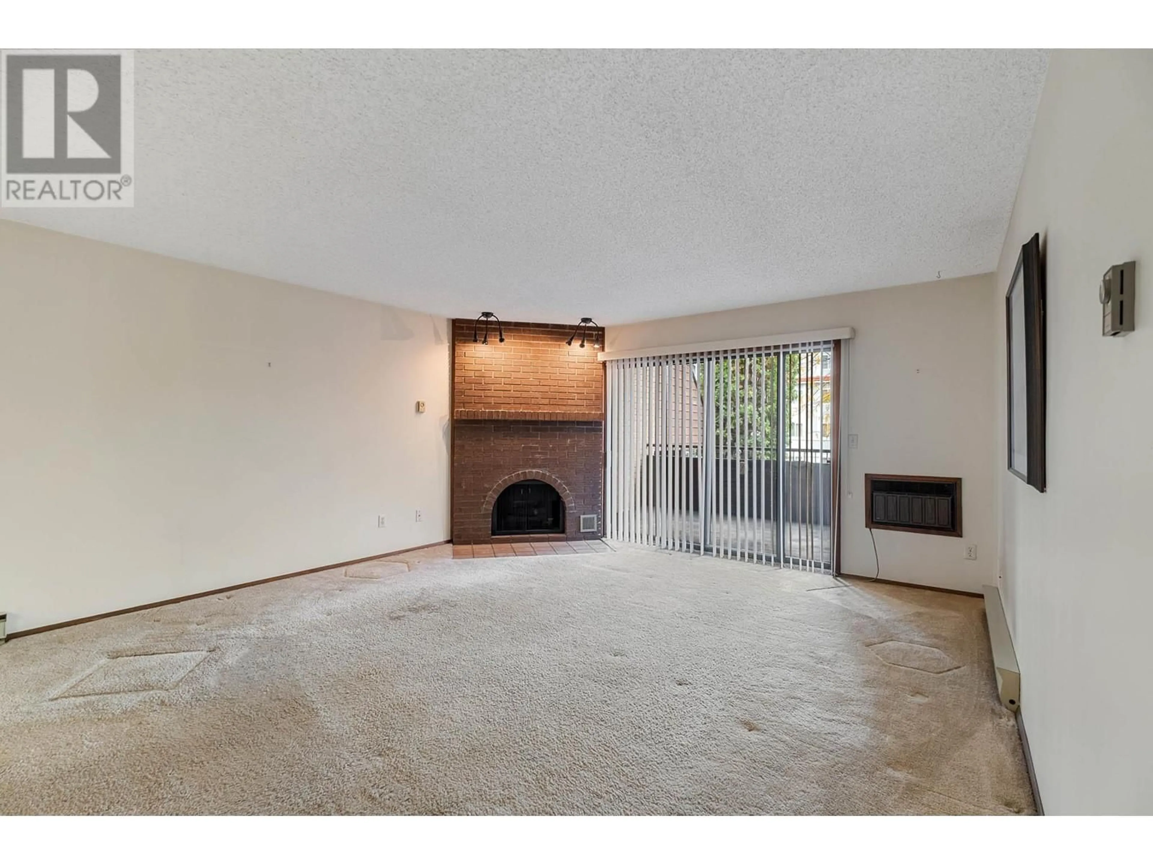 A pic of a room, carpet floors for 983 Bernard Avenue Unit# 201, Kelowna British Columbia V1Y6P7