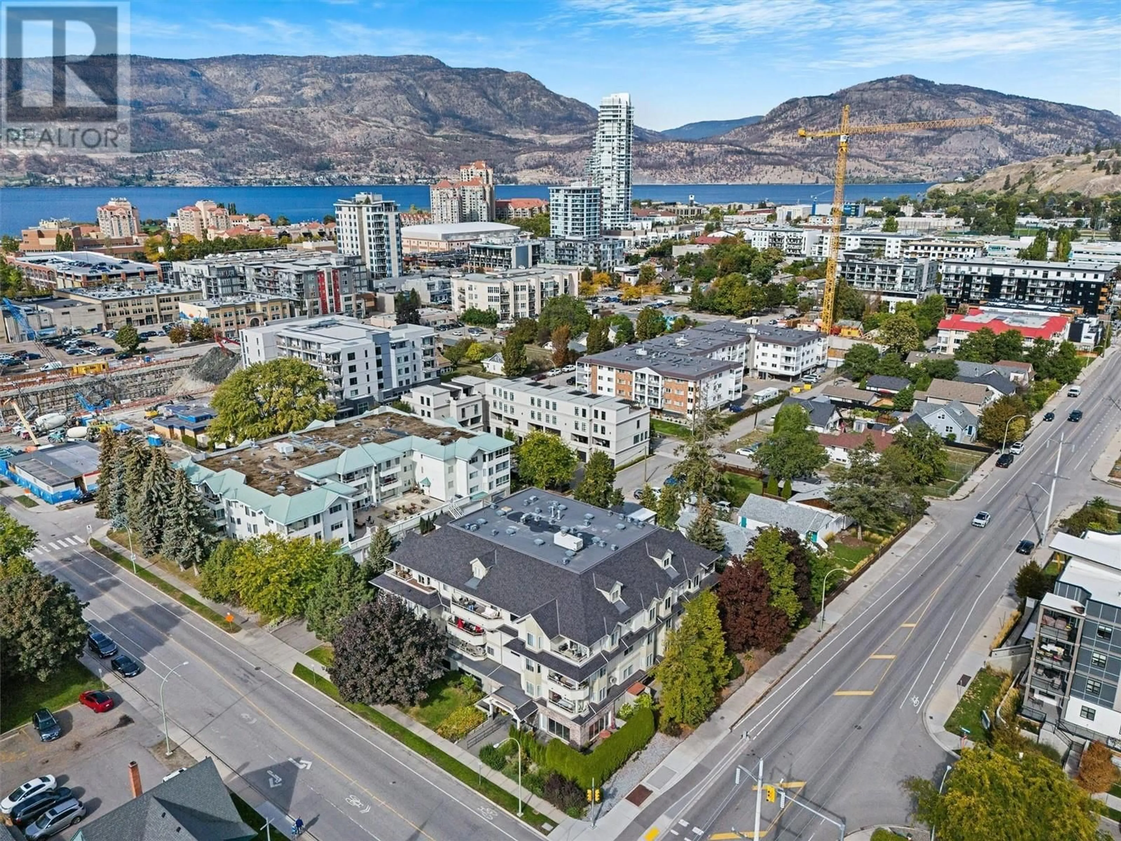 A pic from exterior of the house or condo, the view of city buildings for 680 Doyle Avenue Unit# 306, Kelowna British Columbia V1Y9S2