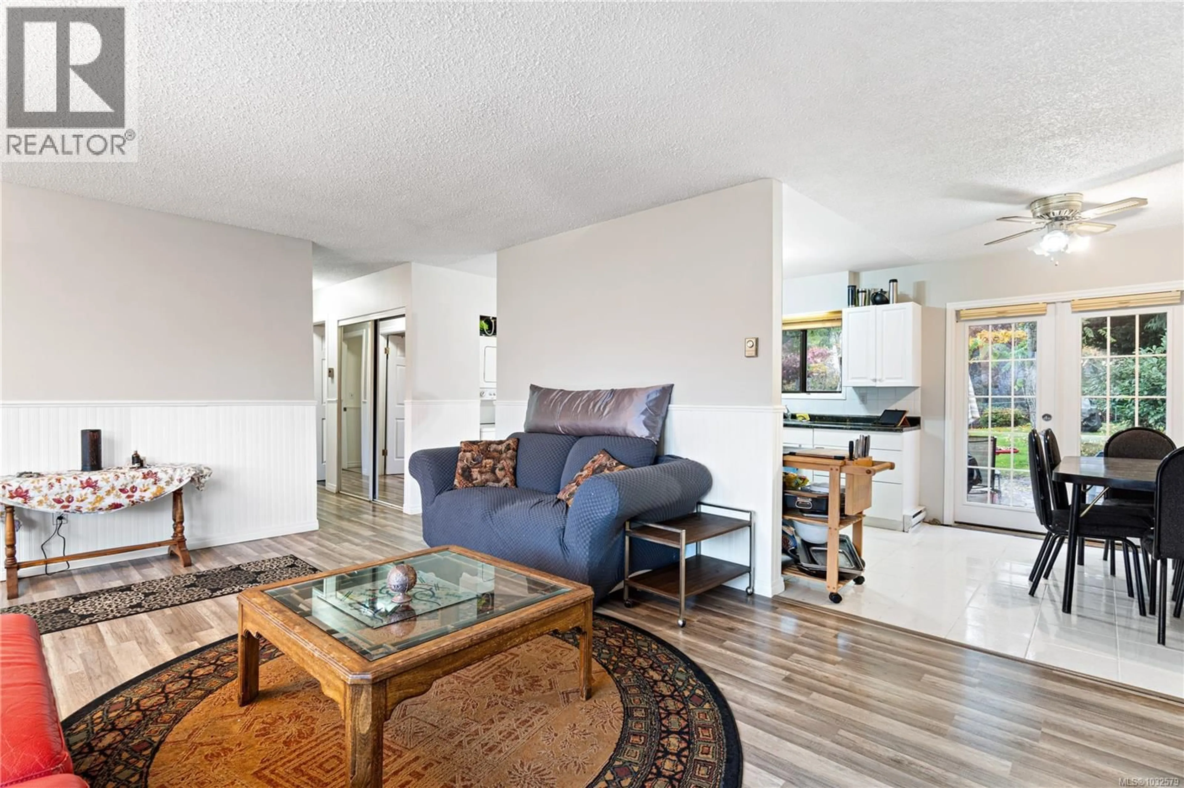 Living room with furniture, wood/laminate floor for 134 FINHOLM STREET SOUTH, Parksville British Columbia V9P1H8